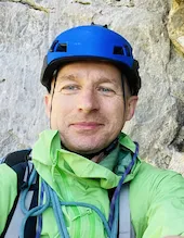 person wearing blue top smiling