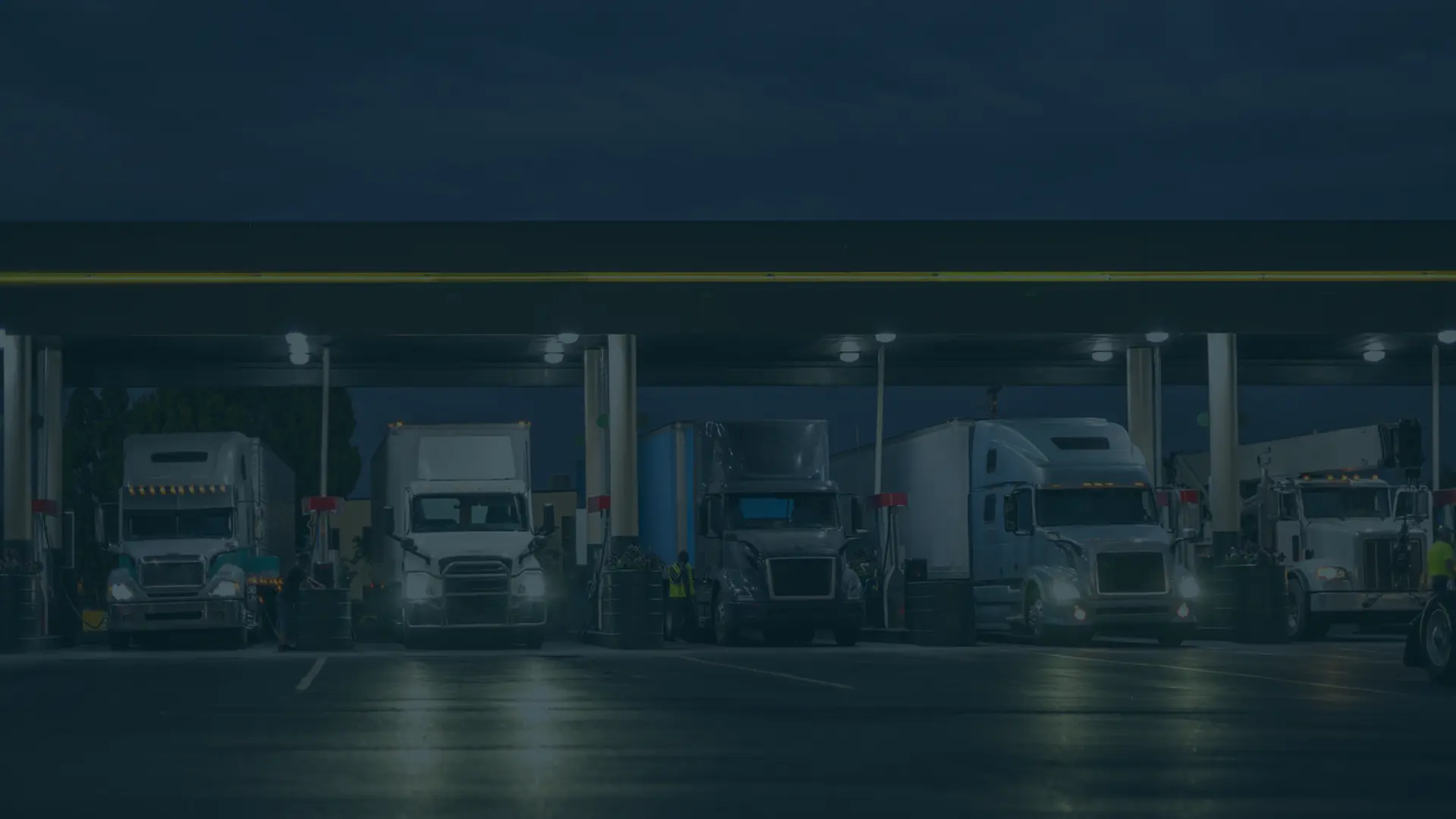 Parked semi-trucks at a gas station