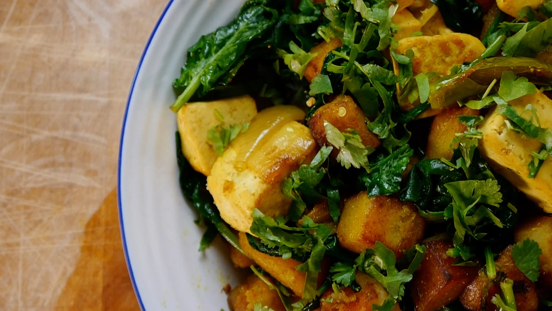 Spiced potato and tofu on plate