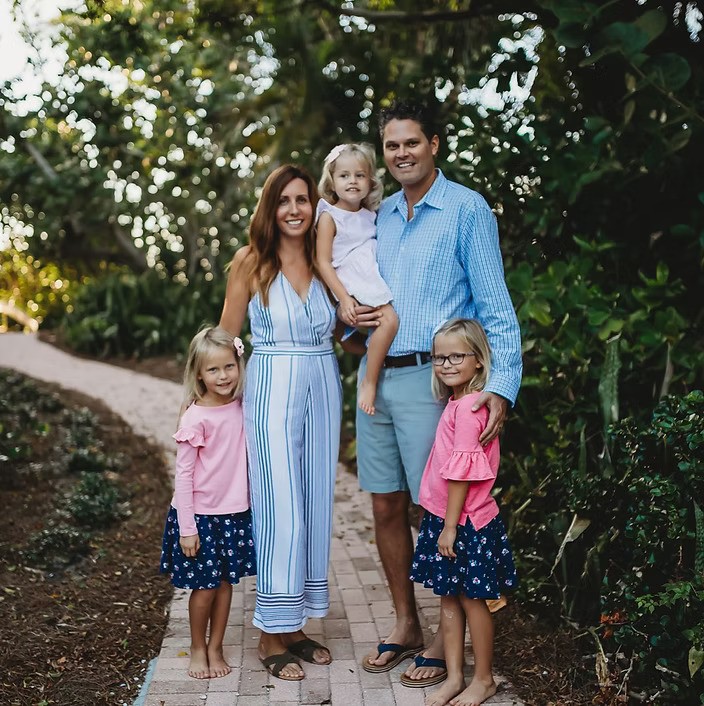 a family with a man, a woman, and three young daughters