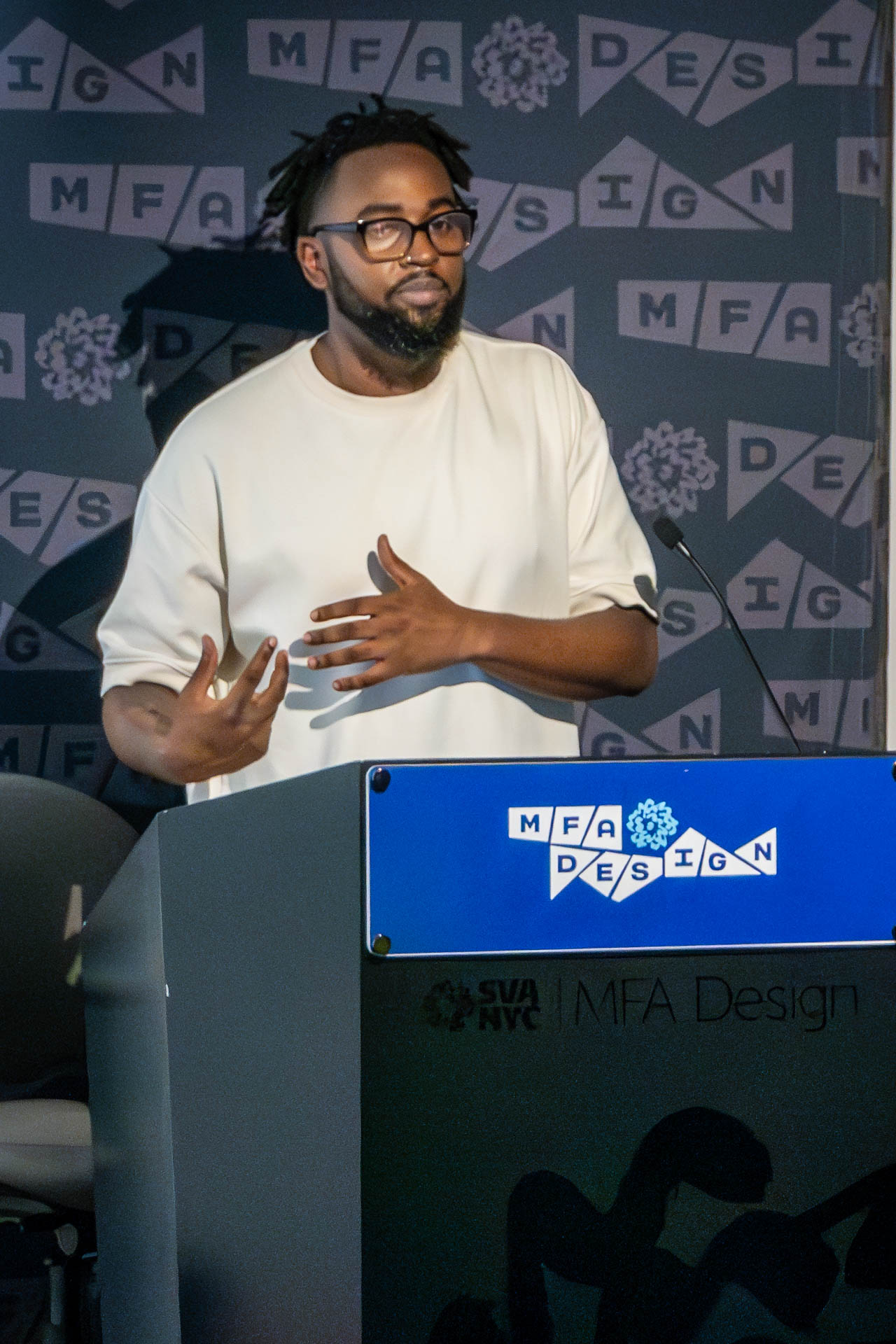 student at a podium giving a presentation
