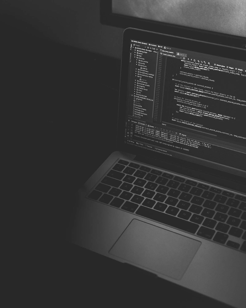 Visual for Technology Service. Laptop screen displaying code related to software engineering and mobile app development.