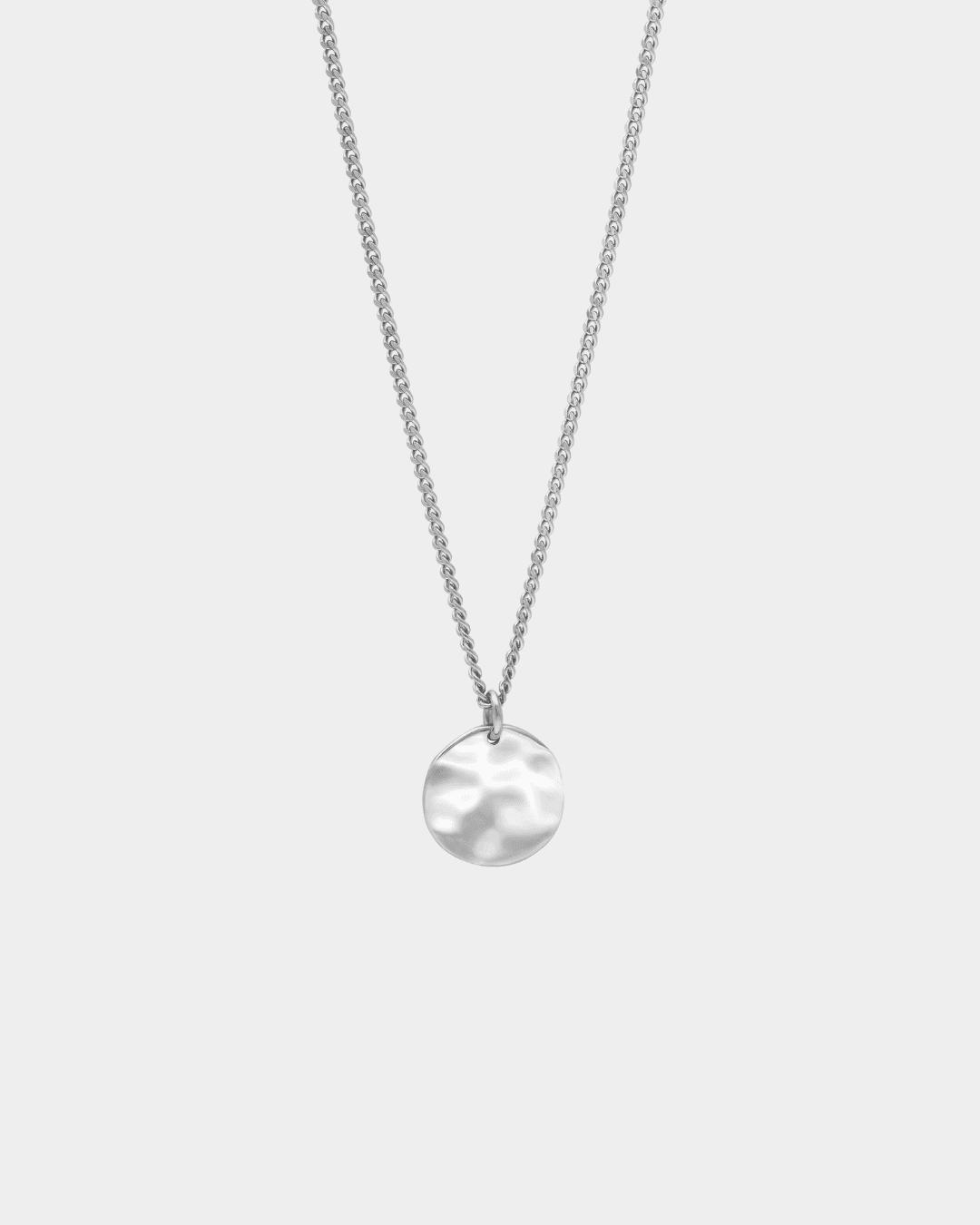 close up detail of front of silver pendant