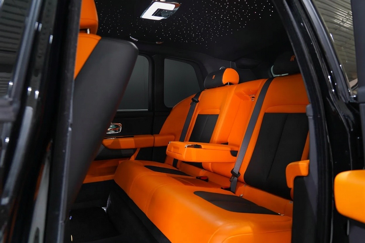 Rear seats interior of Rolls-Royce Cullinan Mansory-style 2023, luxury SUV with executive rear seating and premium leather finish