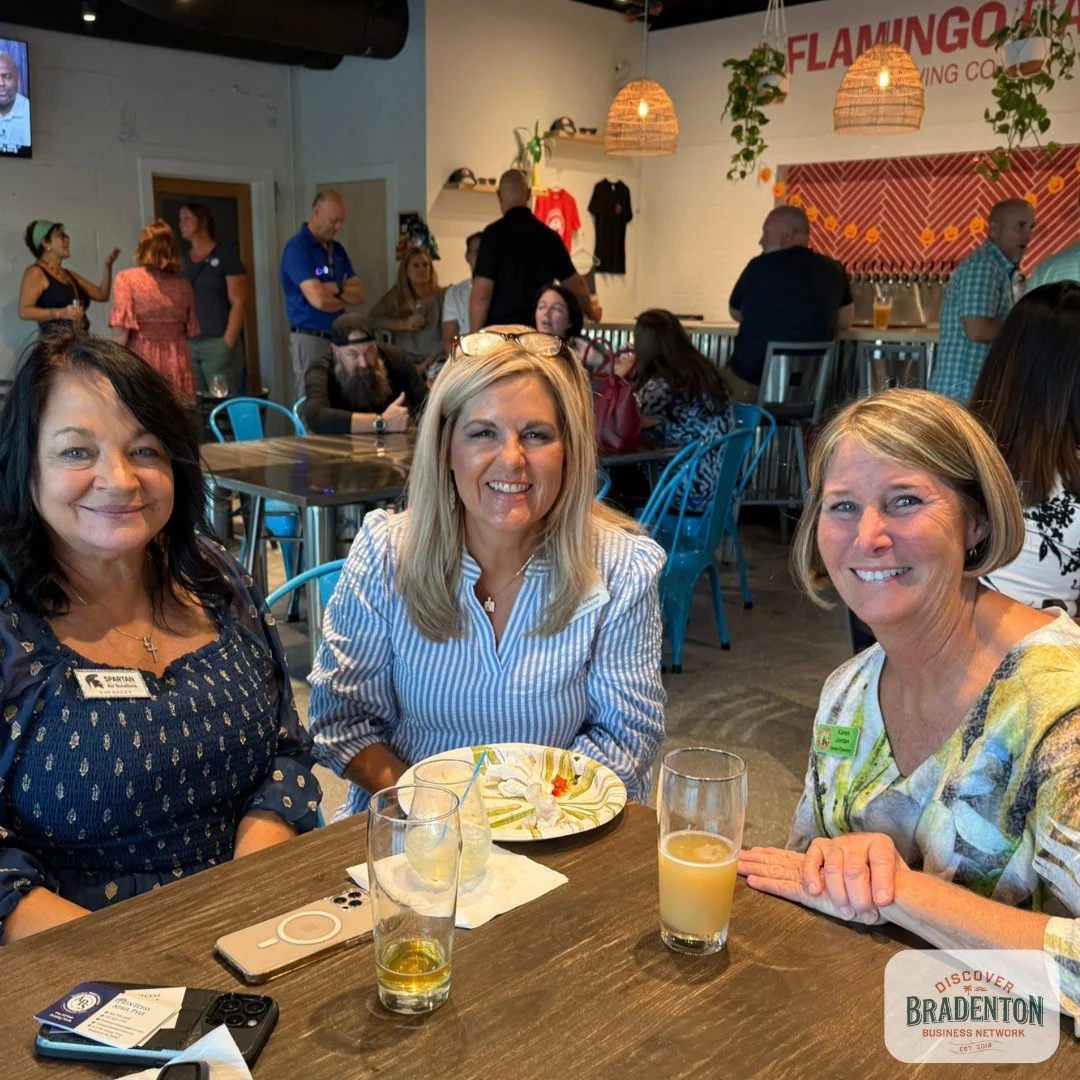 3 people seated at table in bar bradenton