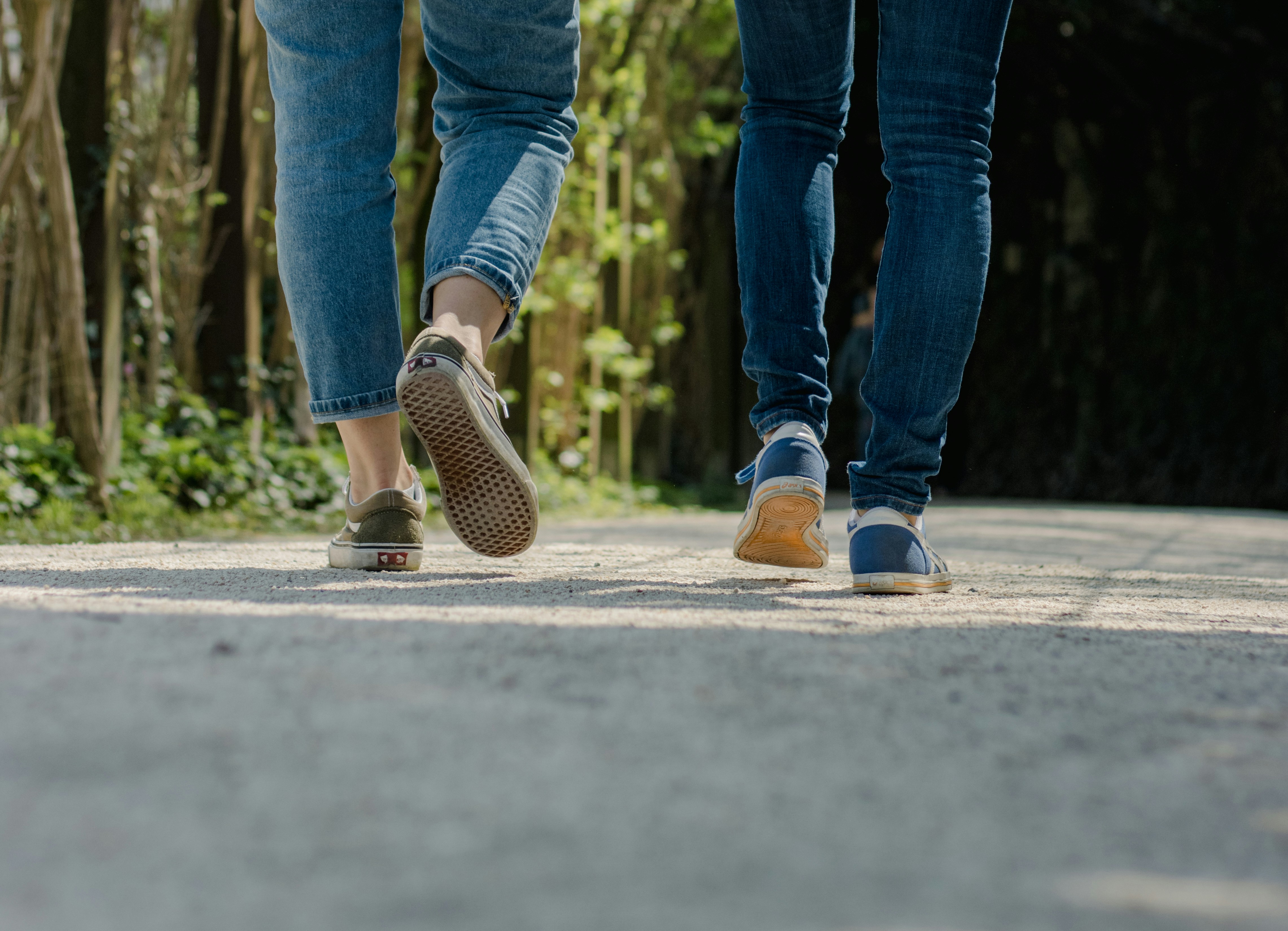 Two people walking together during an outdoor conversation