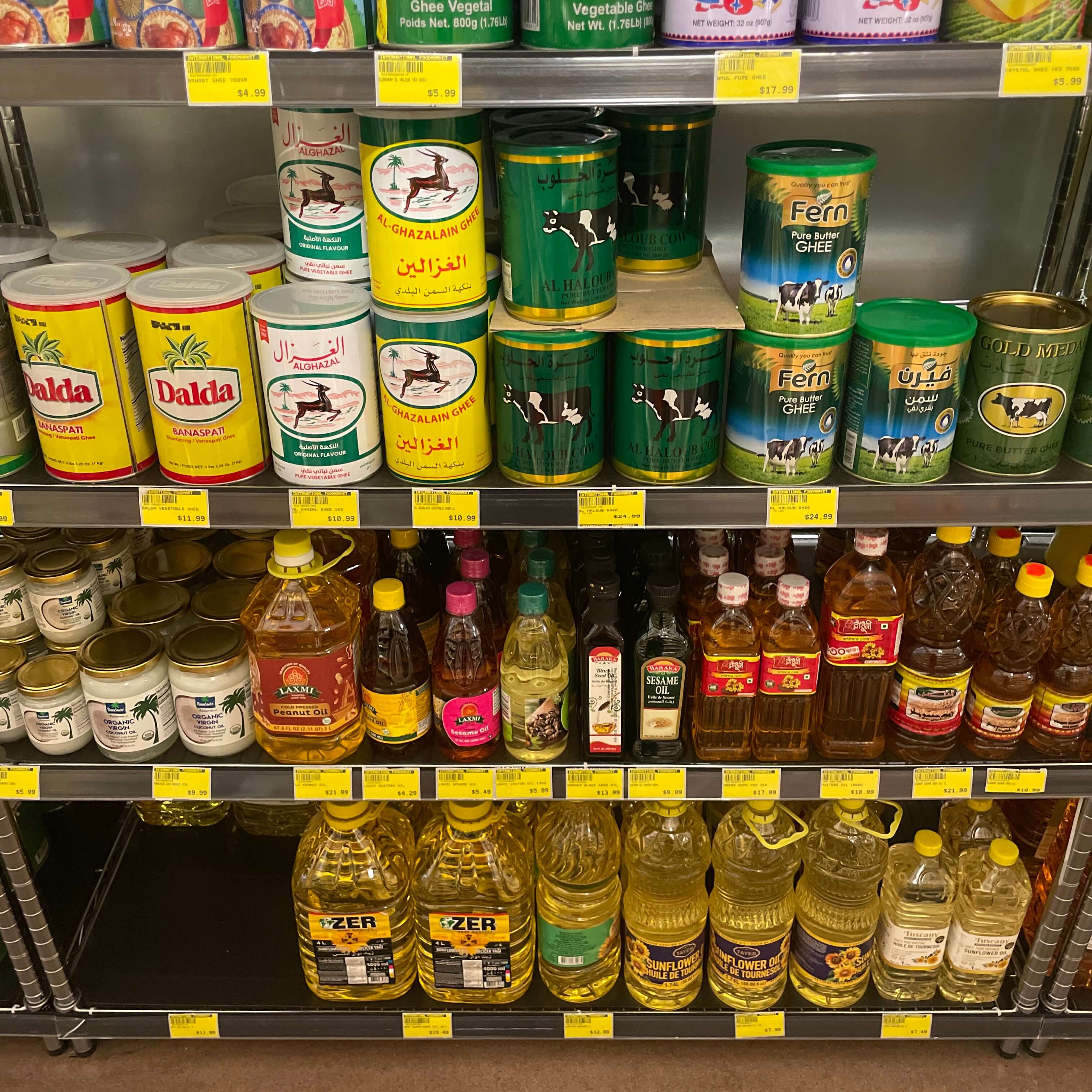 Cooking oils, specialty oils, and ghee tins at International Food Market Orlando.