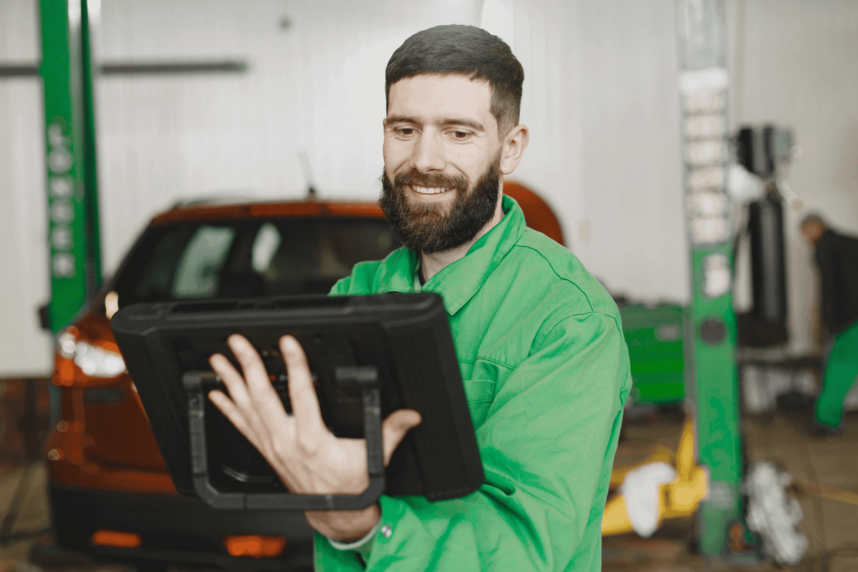 Mechanic working on his tablet