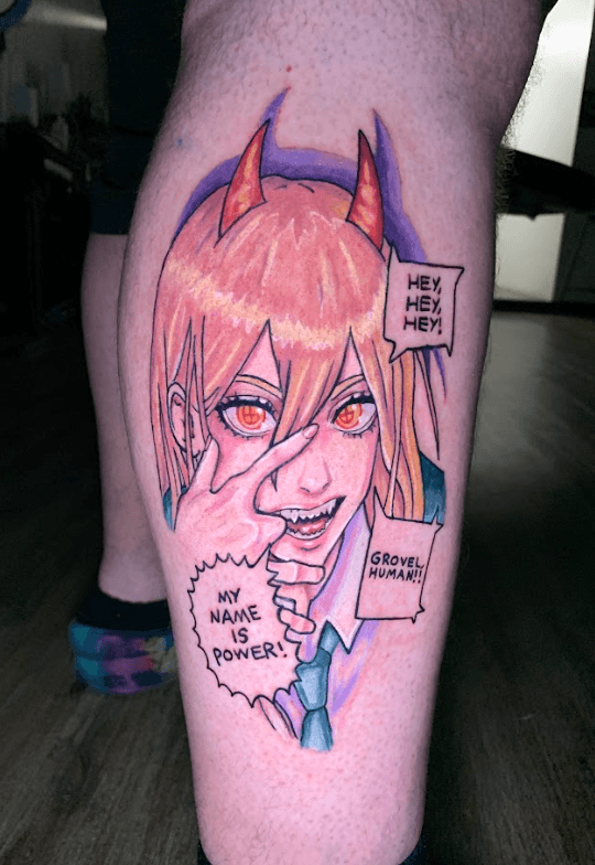 A vibrant tattoo of a chainsaw-like creature on a person's forearm. The tattoo is detailed with shades of orange, black, teal, and red.