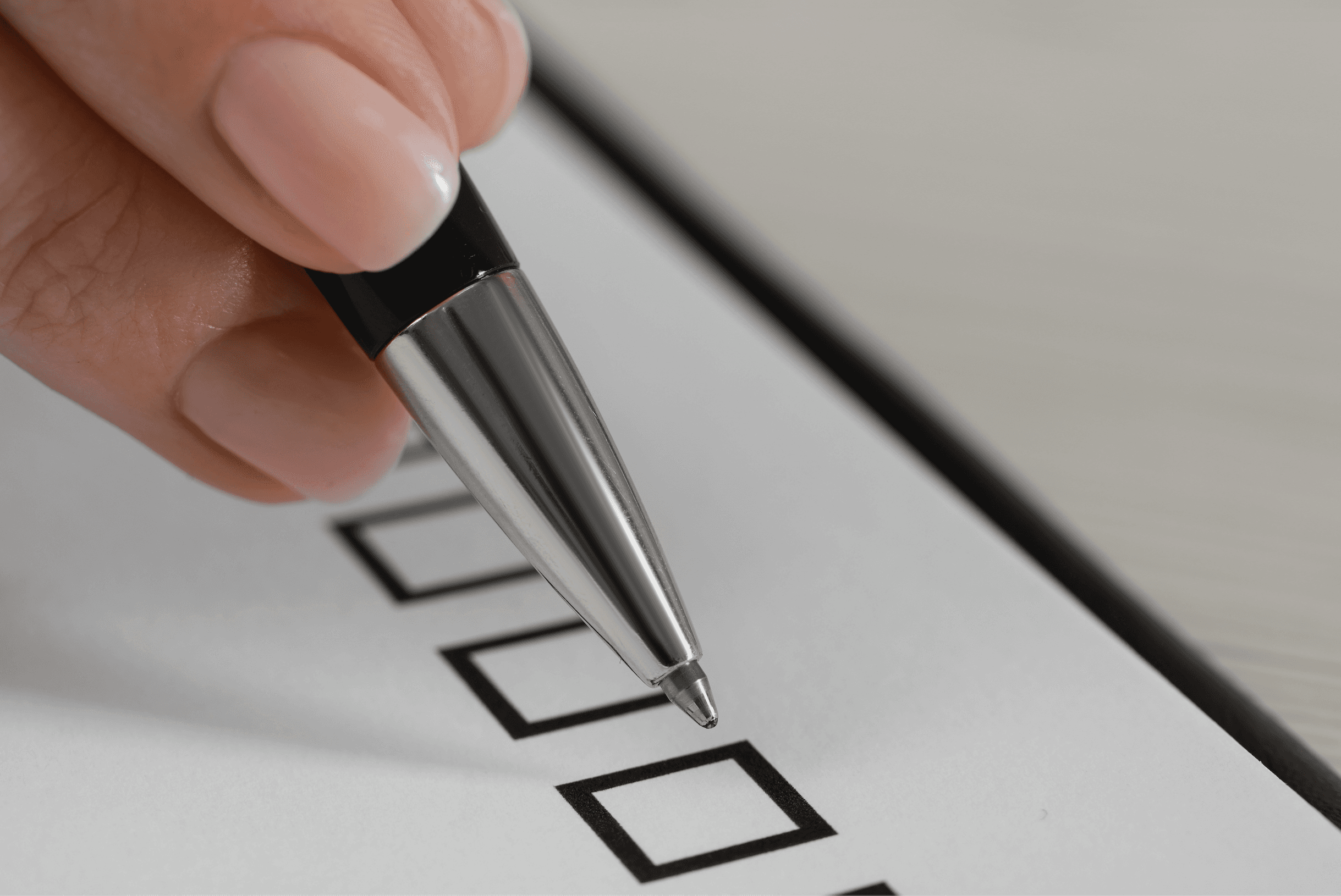 a person ticking an option in an survey