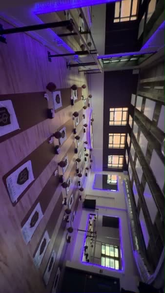 LIRA Sculpt Pilates studio room with mats set up under violet lighting