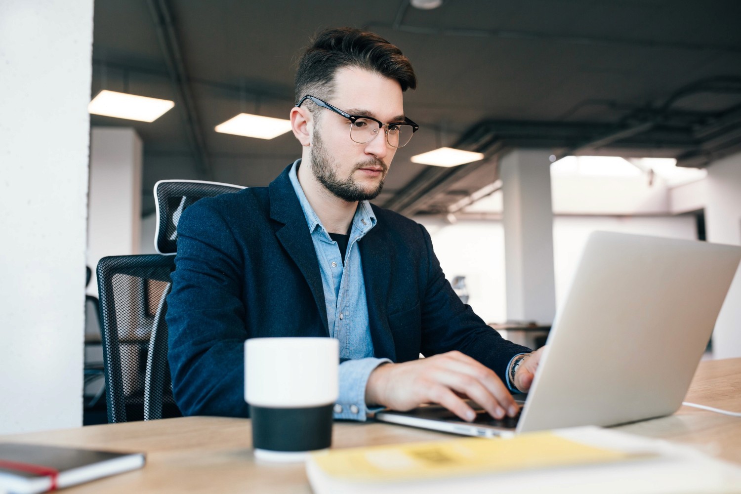 man using a laptop - Loosely Structured Data Business Example
