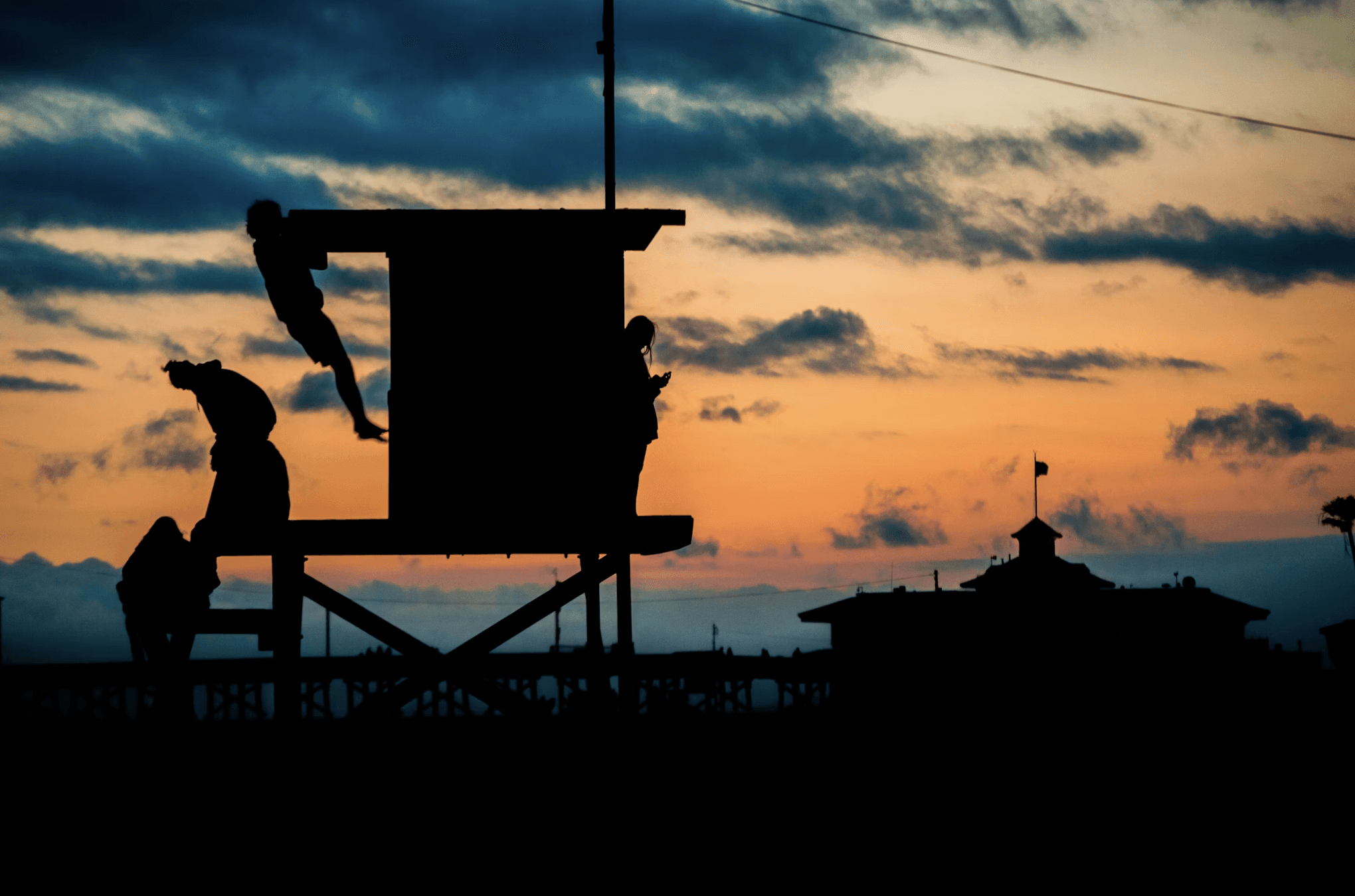 Cinematic Image of Men Performing Pull-Ups at The Beach