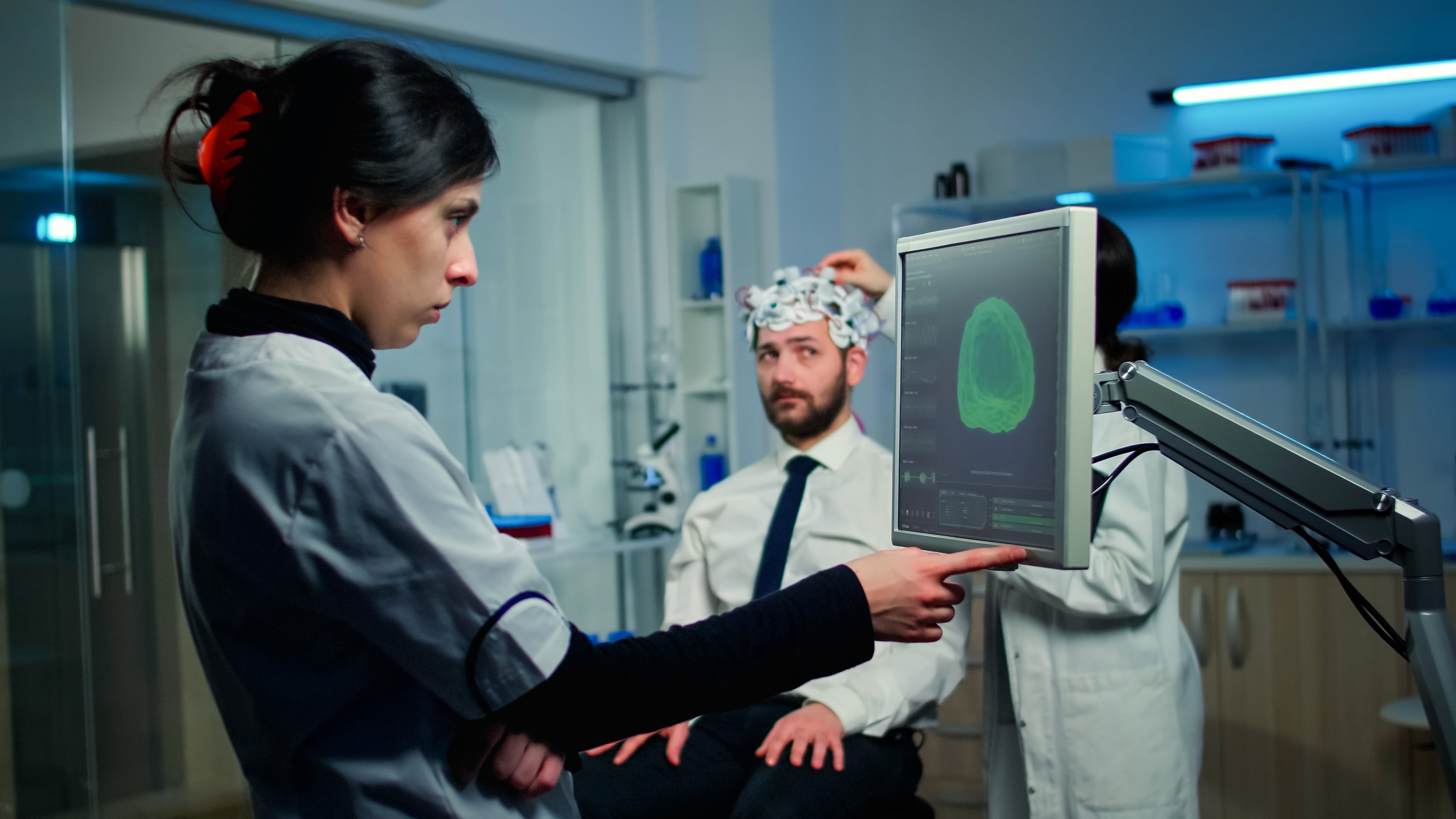 A doctor viewing and analysing a brain scan.