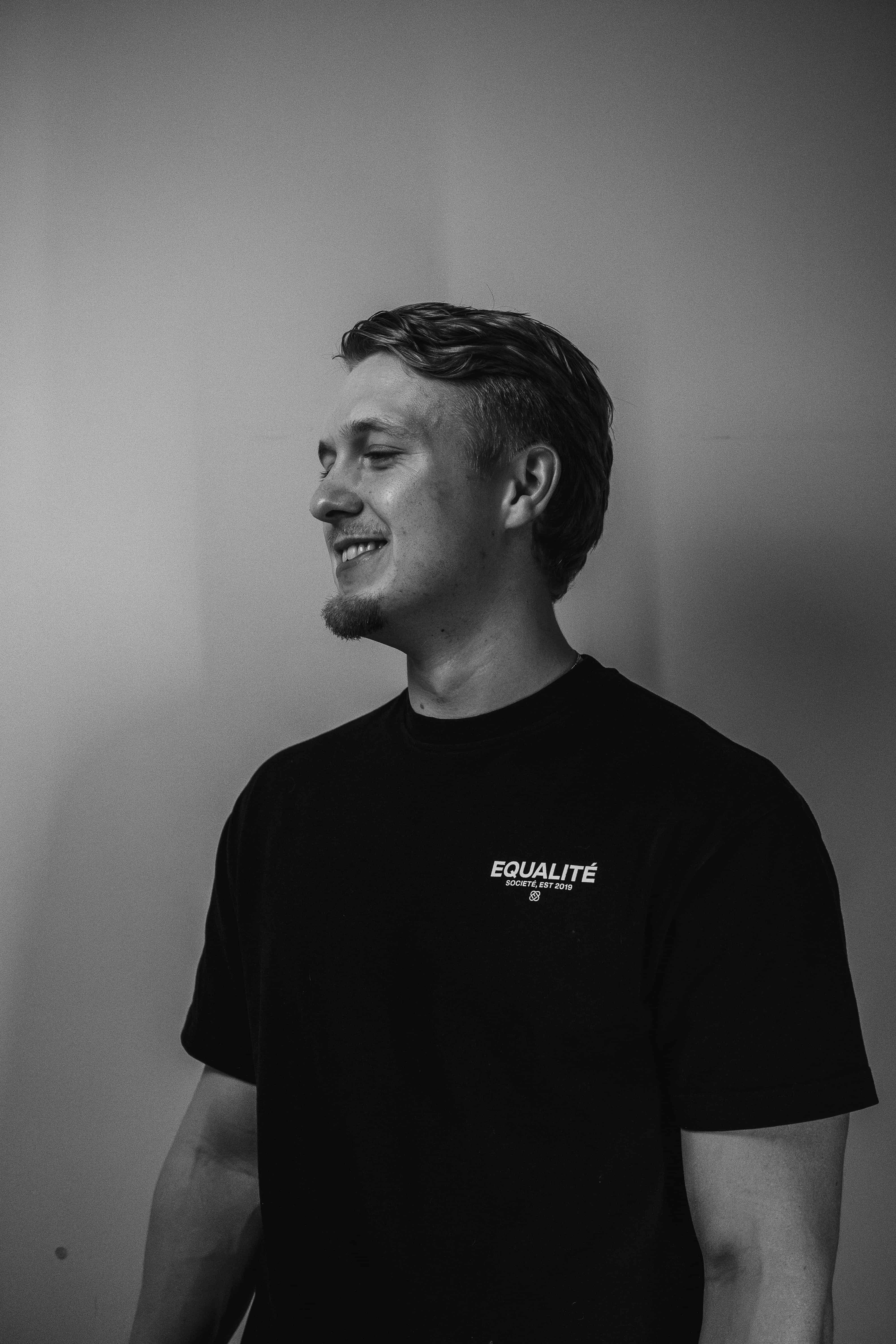 a blurry photo of a person standing in front of a wall