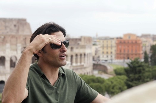 men with sunglasses in front of the coliseum