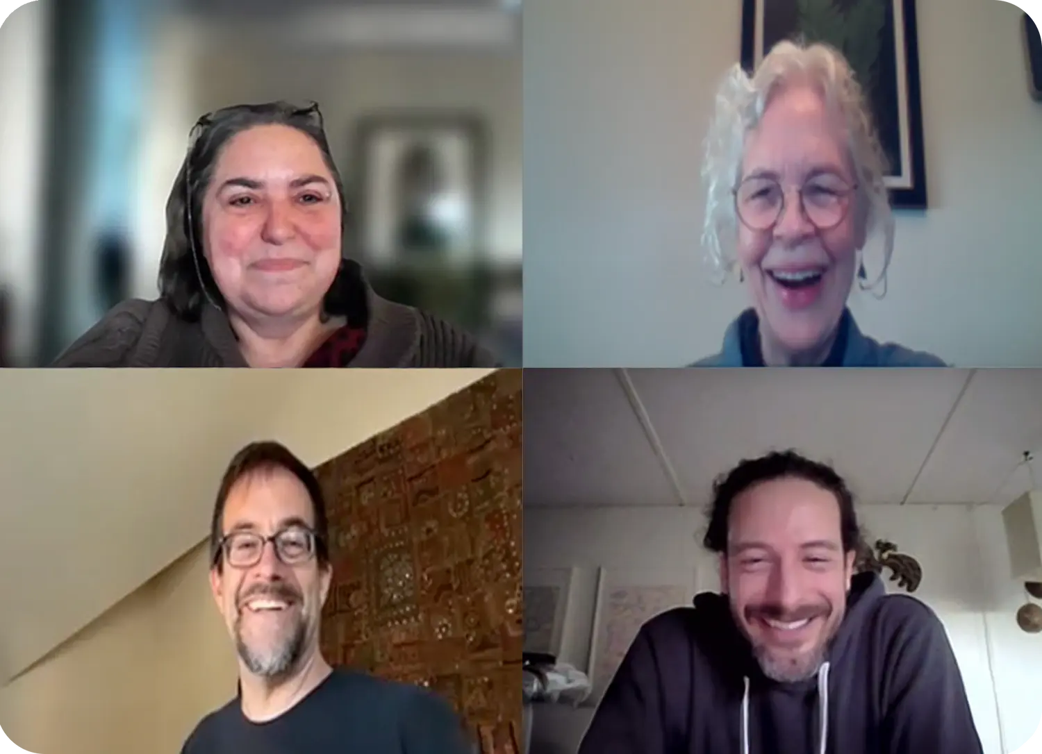 Four future neighbors smiling during a virtual video call meeting.