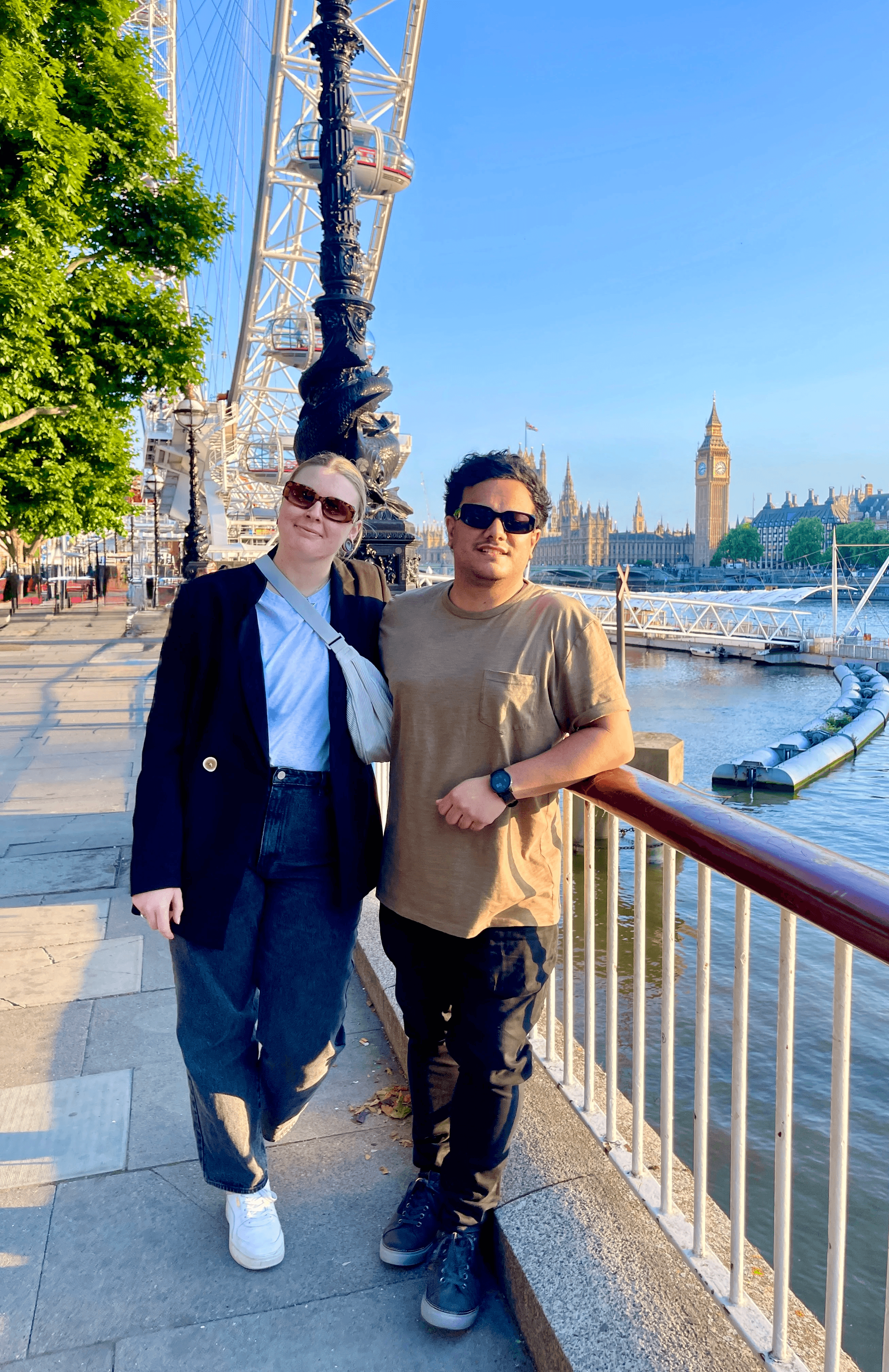 A bride and groom share a kiss, enveloped in the bride's flowing veil. The soft focus and gentle light convey a romantic, intimate atmosphere.