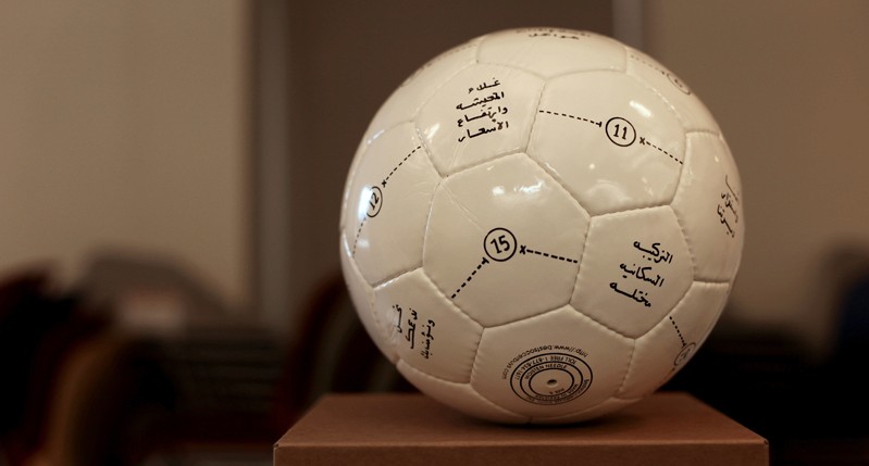 football with Arabic language written on it