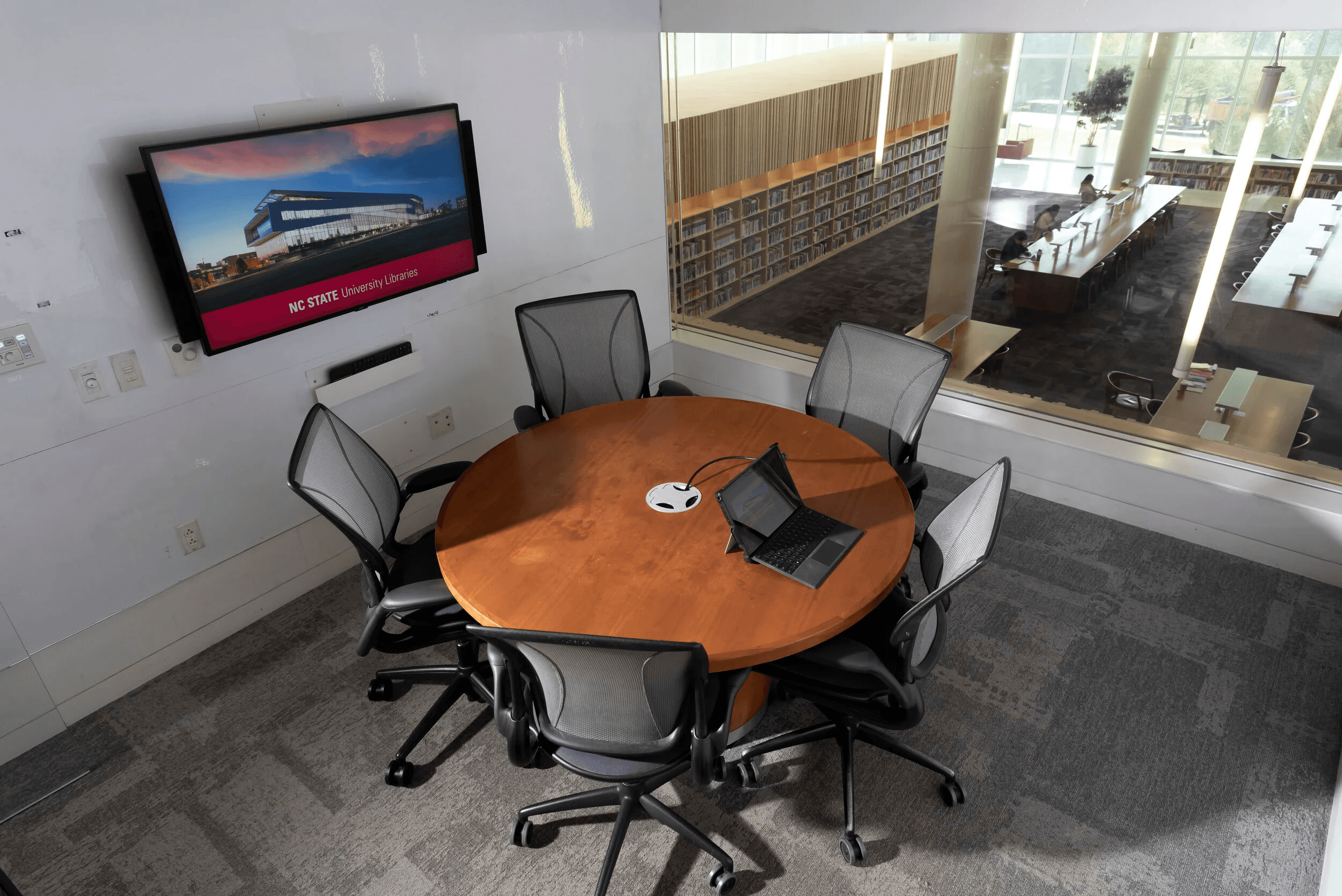 people sitting on chairs watching a game