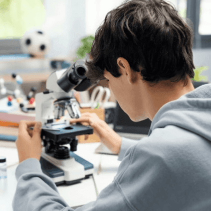 Boy looking through microscope