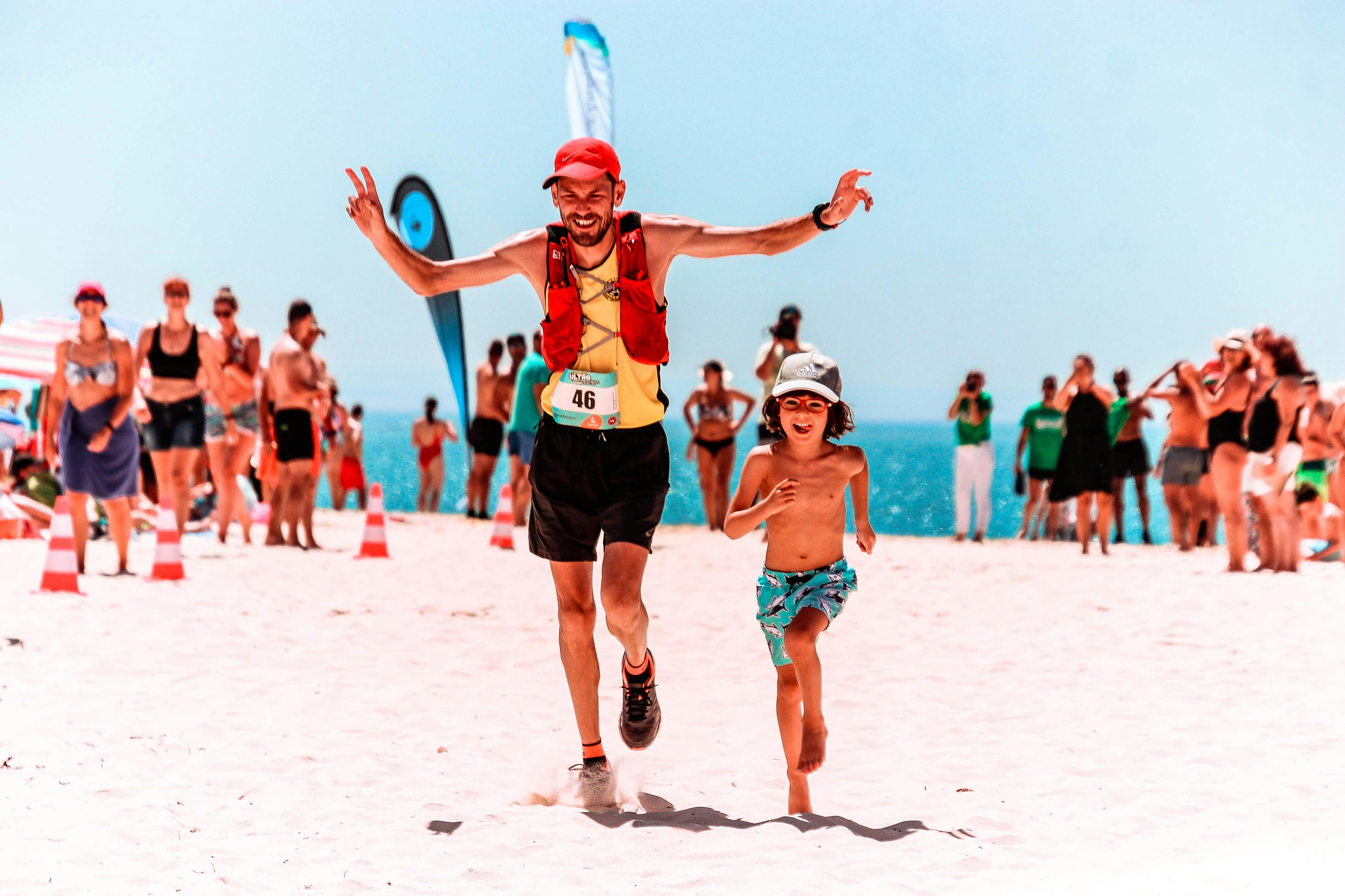 A man stading with Surfboard