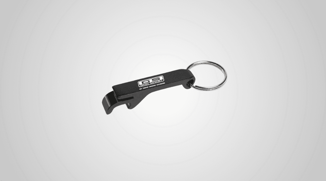 A black branded bottle opener keychain.