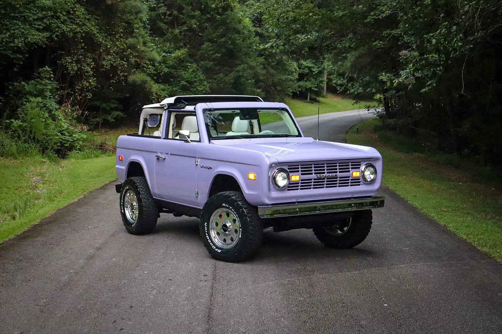 Man with camera near lake and mountains