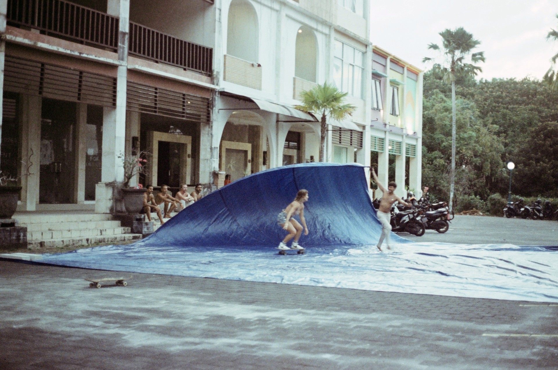 film photography of surf lifestyle and girl riding surf skate and getting a barrel 