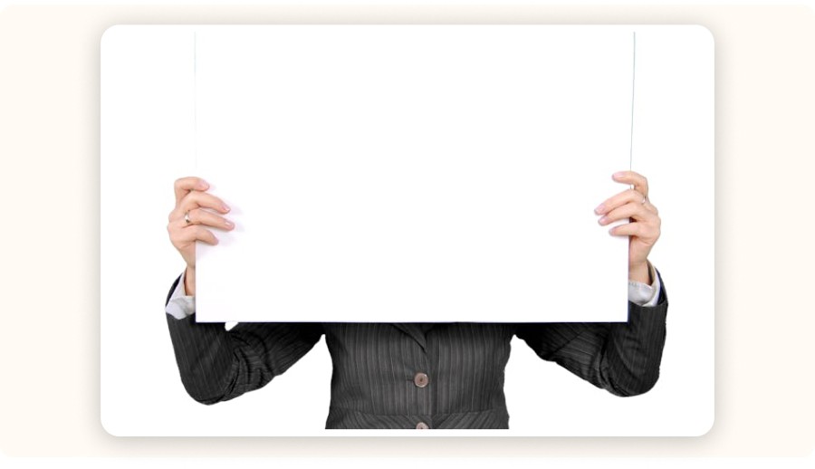 Person holding a blank sign