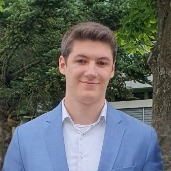 Portrait of Matthias Ölschlegel in a blue coat jacket