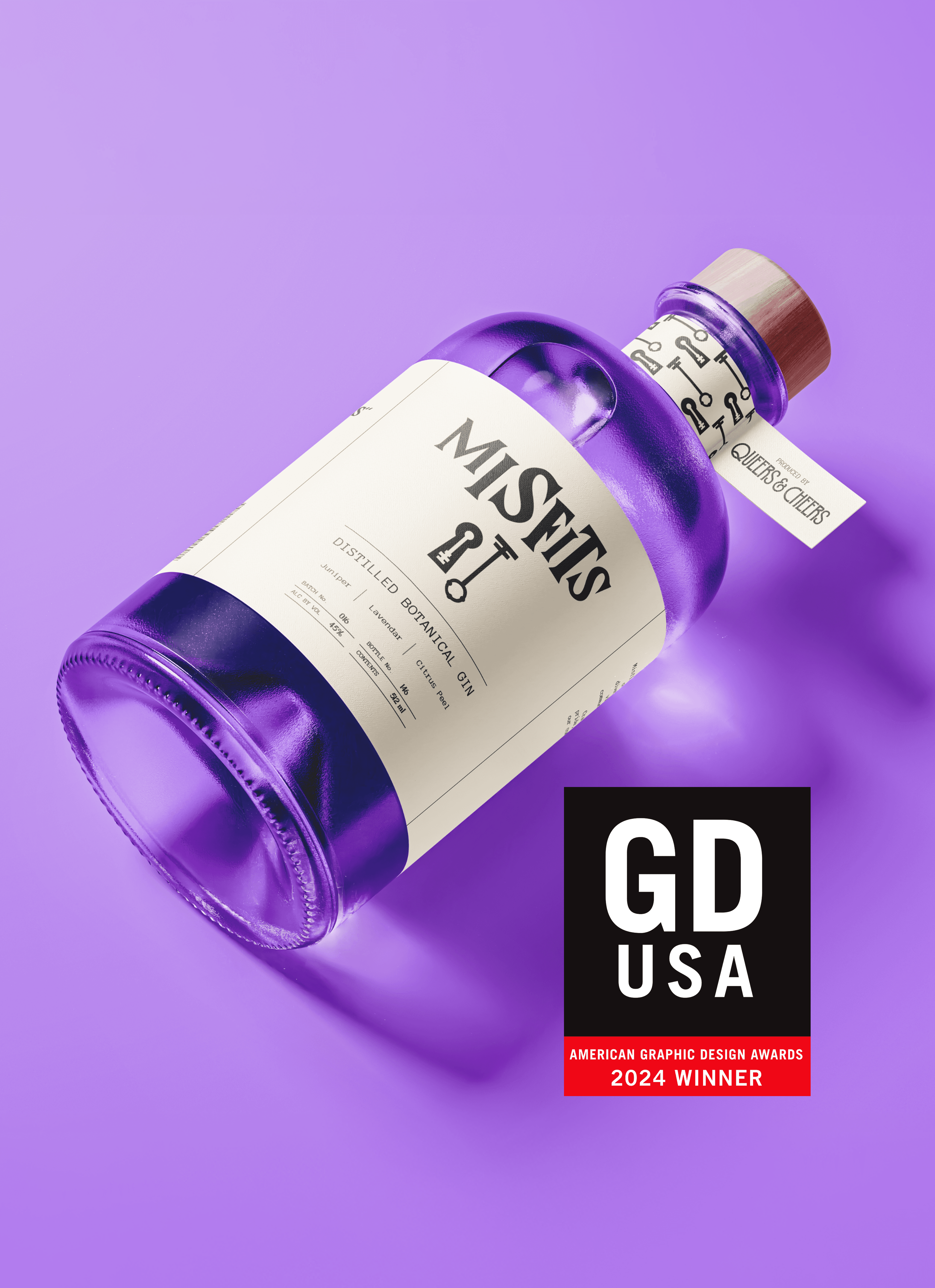 Purple Misfits Gin bottle with white label, lying on a purple surface.
