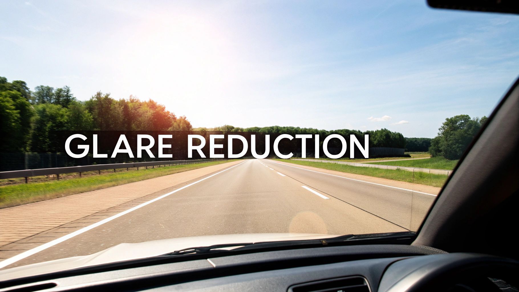 View from a car windshield on a sunny highway with 'GLARE REDUCTION' text displayed.
