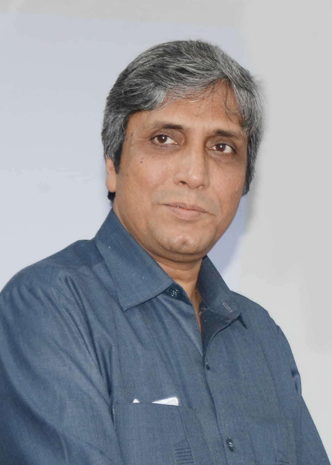 man standing beside wall