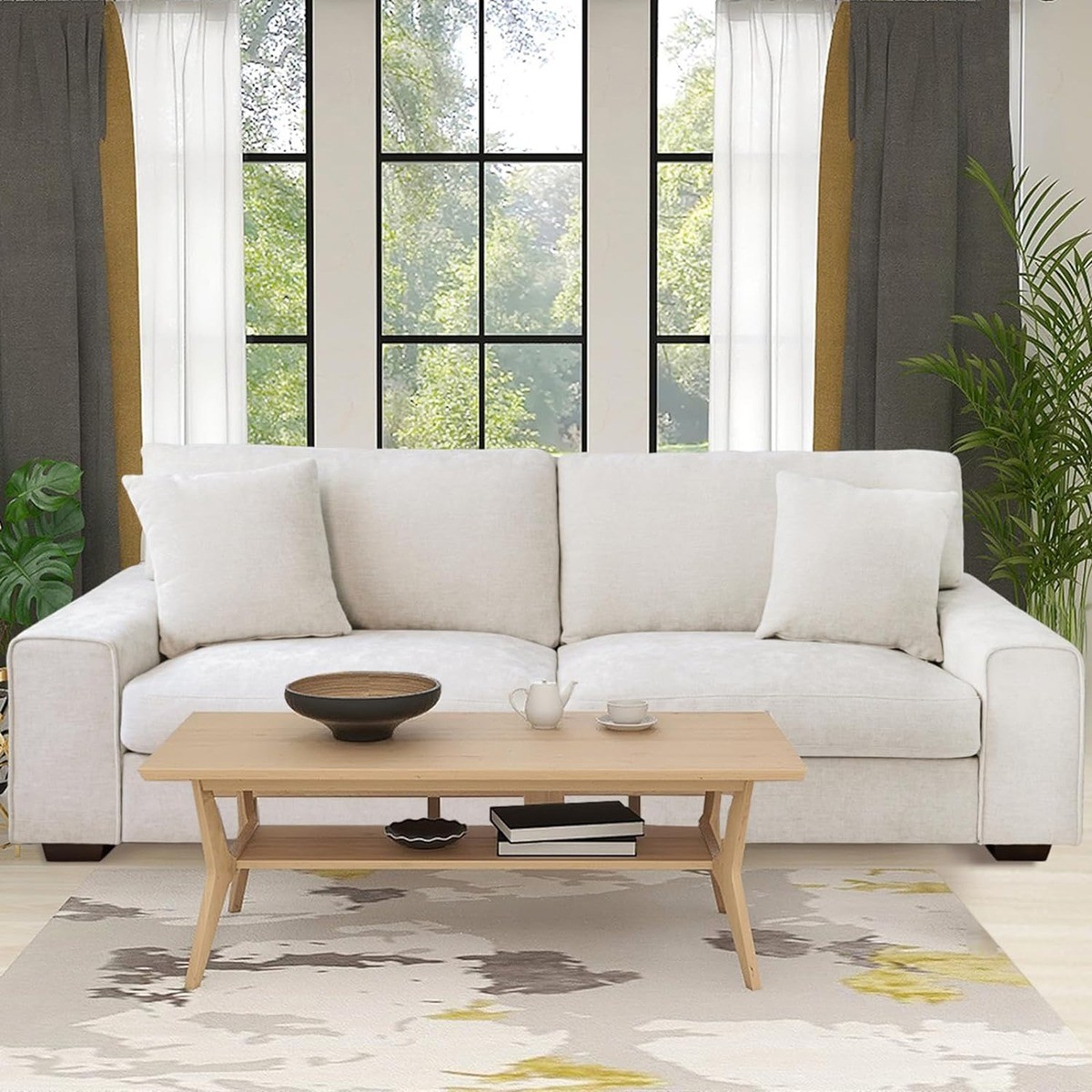 DOPEDIO modern white chenille recliner sofa in a bright living room with large windows, a wood table, & an abstract rug