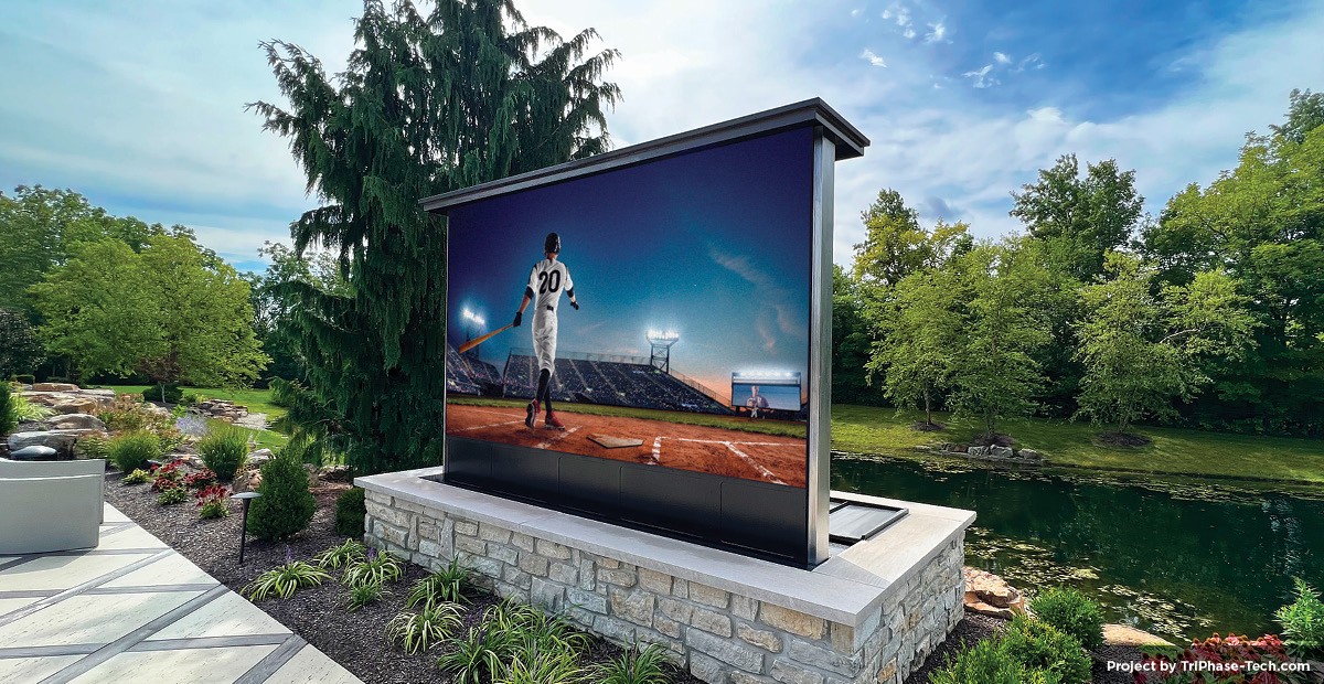Outdoor TV displaying a baseball game in a garden.