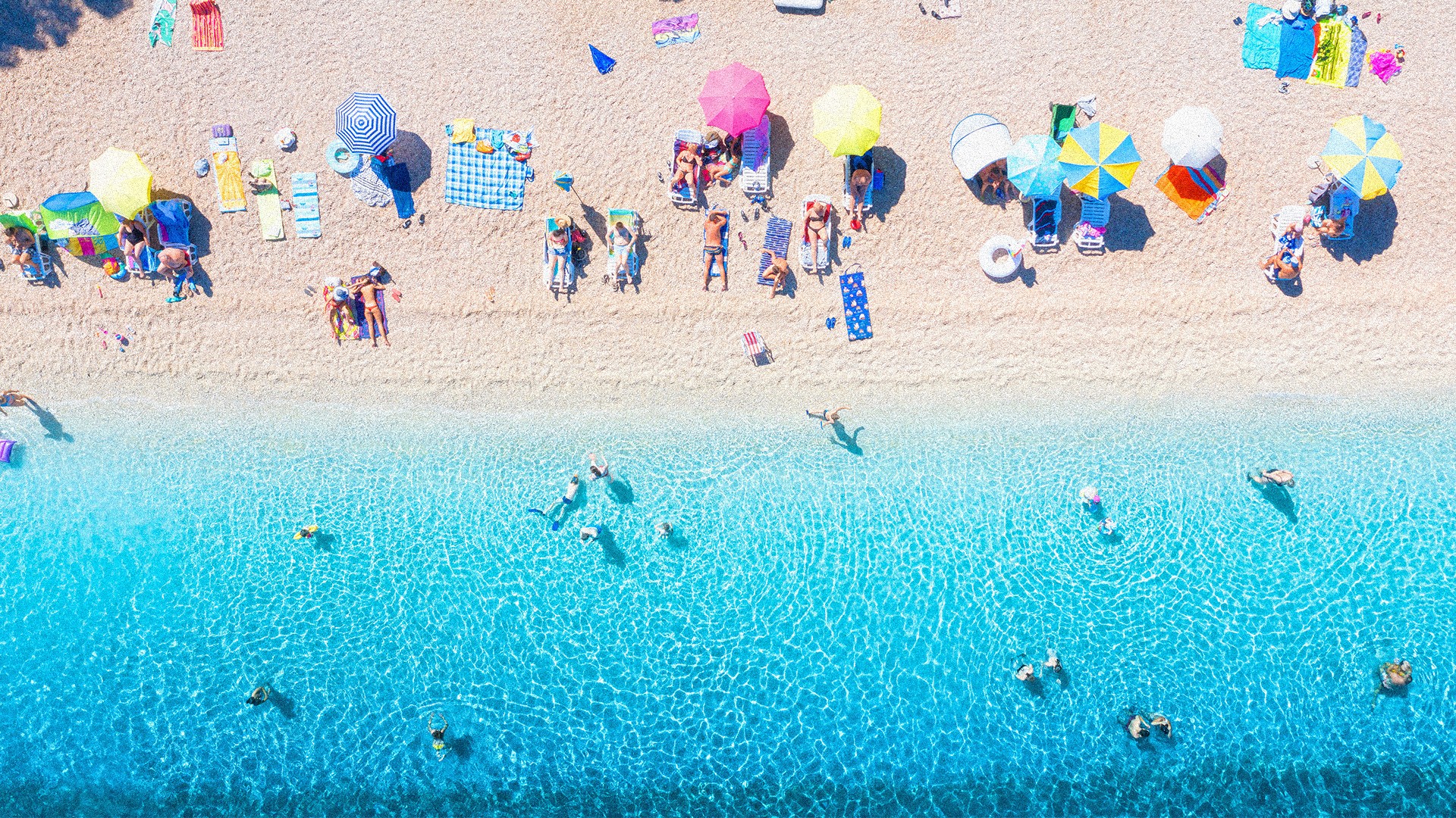 An aerial shot of people on the beach.
