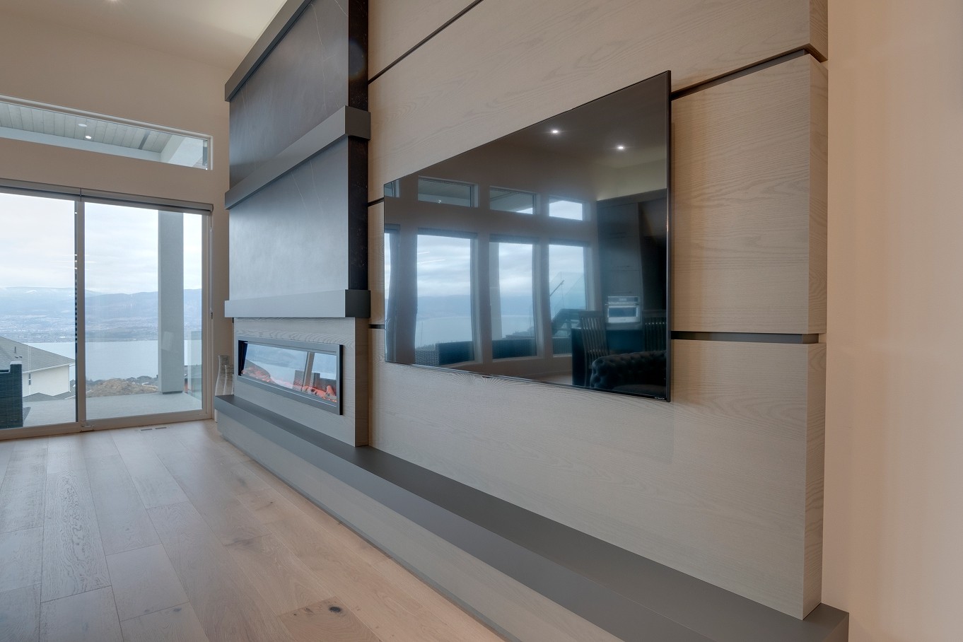 Side view of fireplace wall with matte grey panels