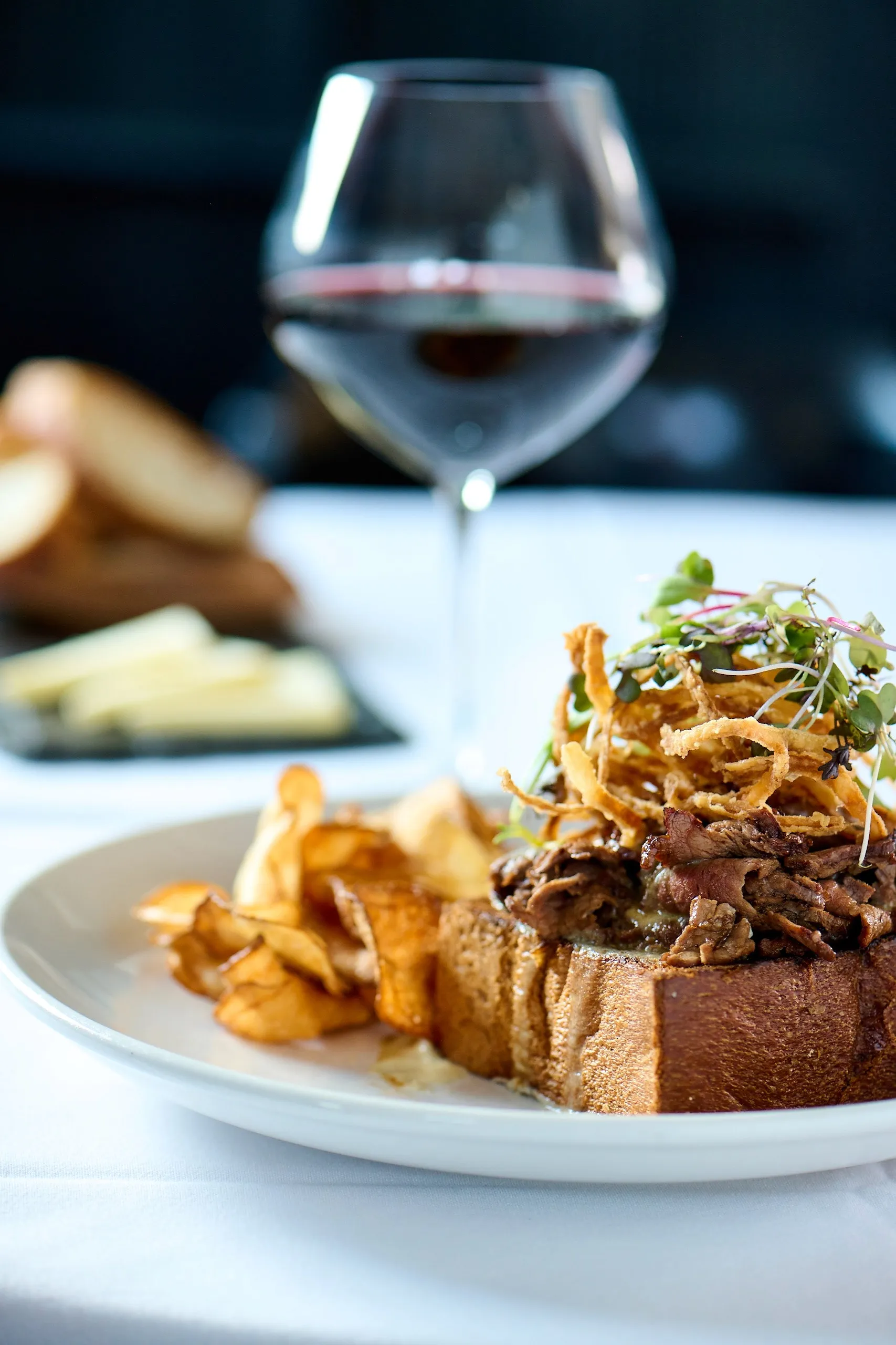 Grilled steak topped with crispy onions and served with golden fries.
