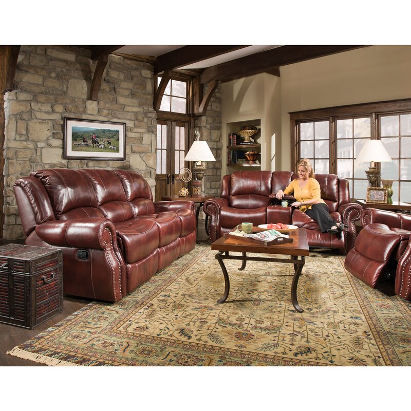 Comfortable reclining sofa in rich leather, perfect for relaxing with adjustable seating and deep cushions.