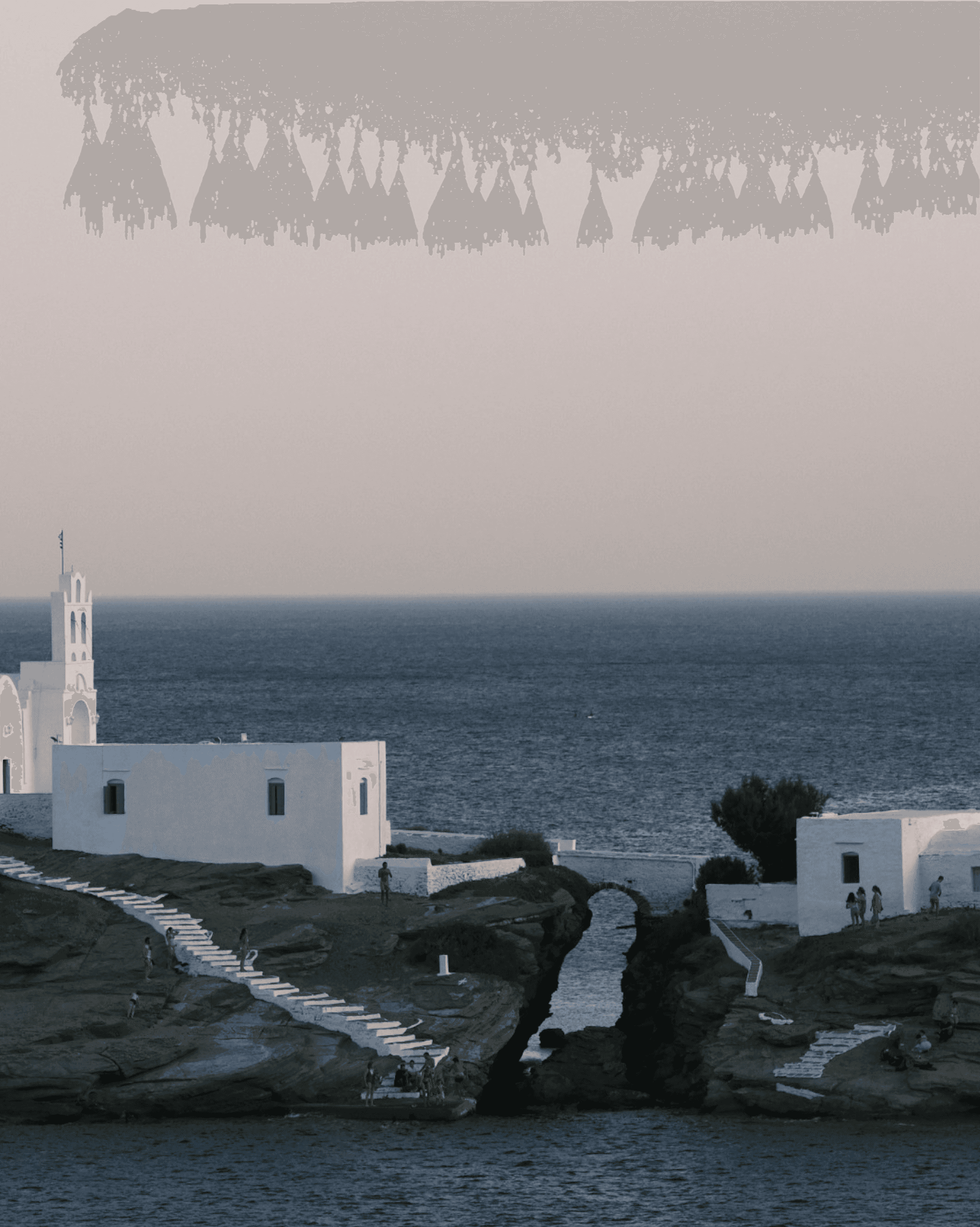 Sunset sky over Sifnos. The monastery and the sea, traditional white washed colors.