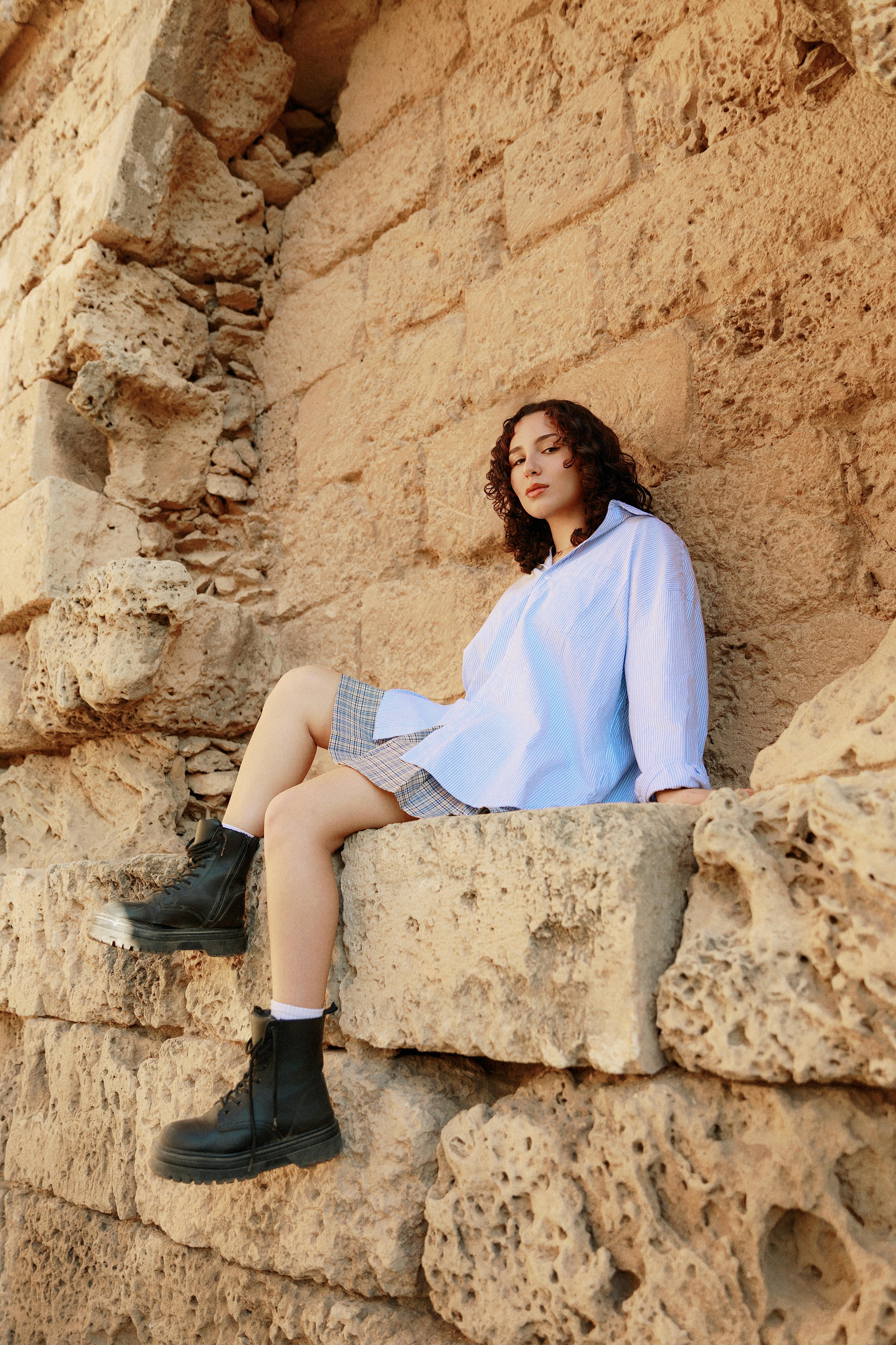 Profile image of LinkedPhone customer - caucasian woman with dark hair sitting at ancient ruins