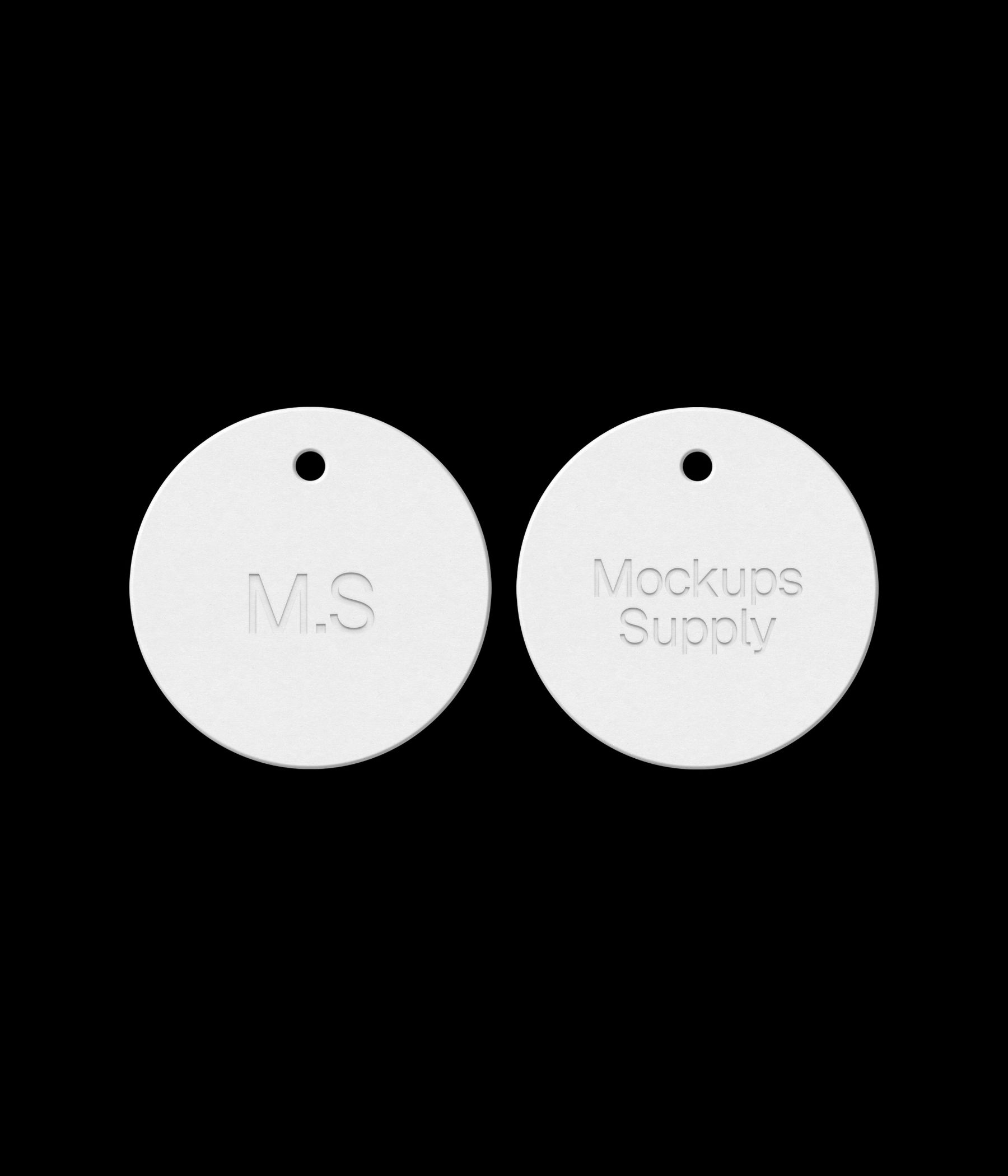 Two white round hang tags on black background showing debossed text effect for photoshop mockup PSD template download