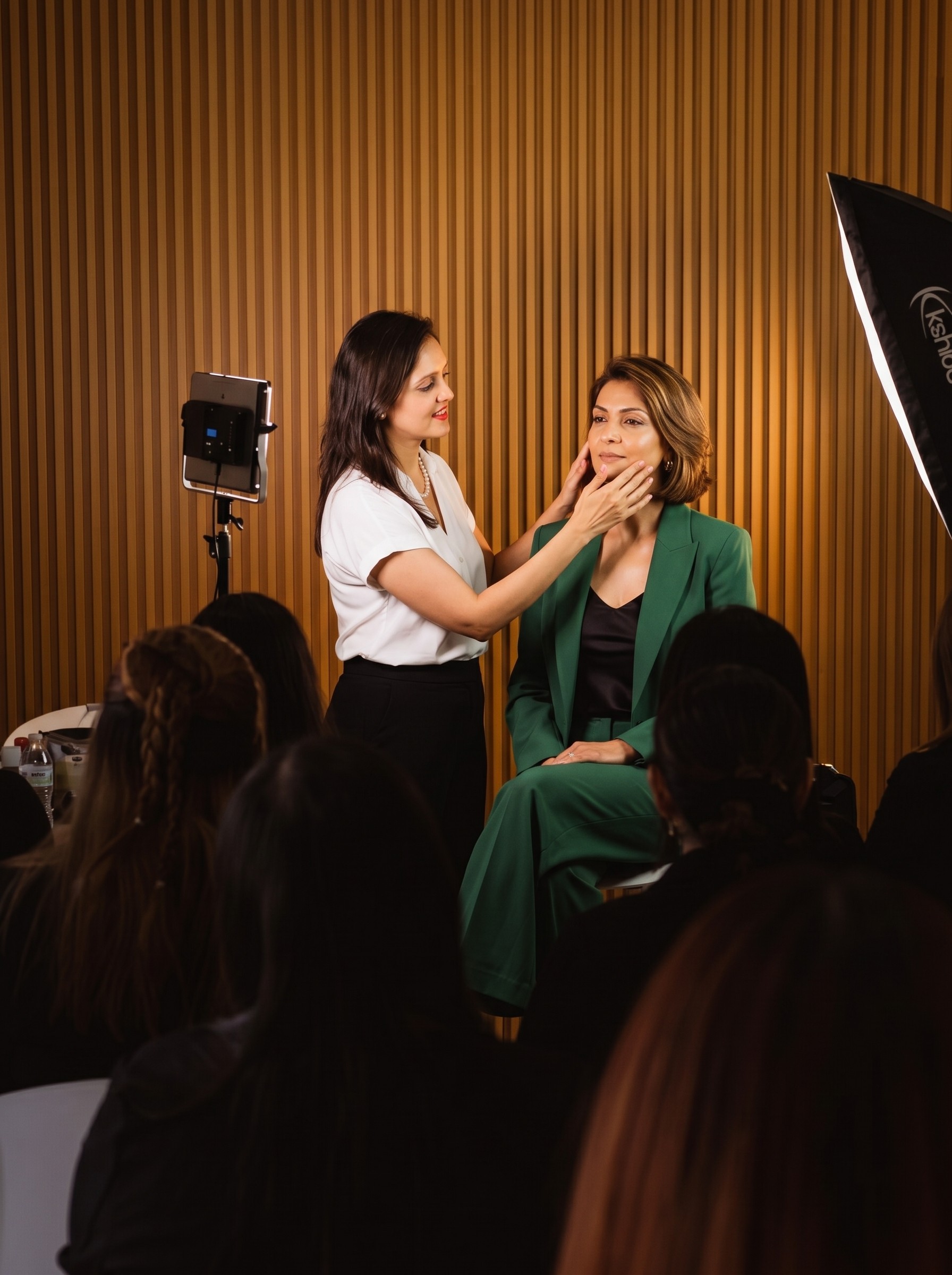Sherali Mehta of Tatvaved conducting an expert skincare and rejuvenation demonstration for a live audience in a professional workshop setting.