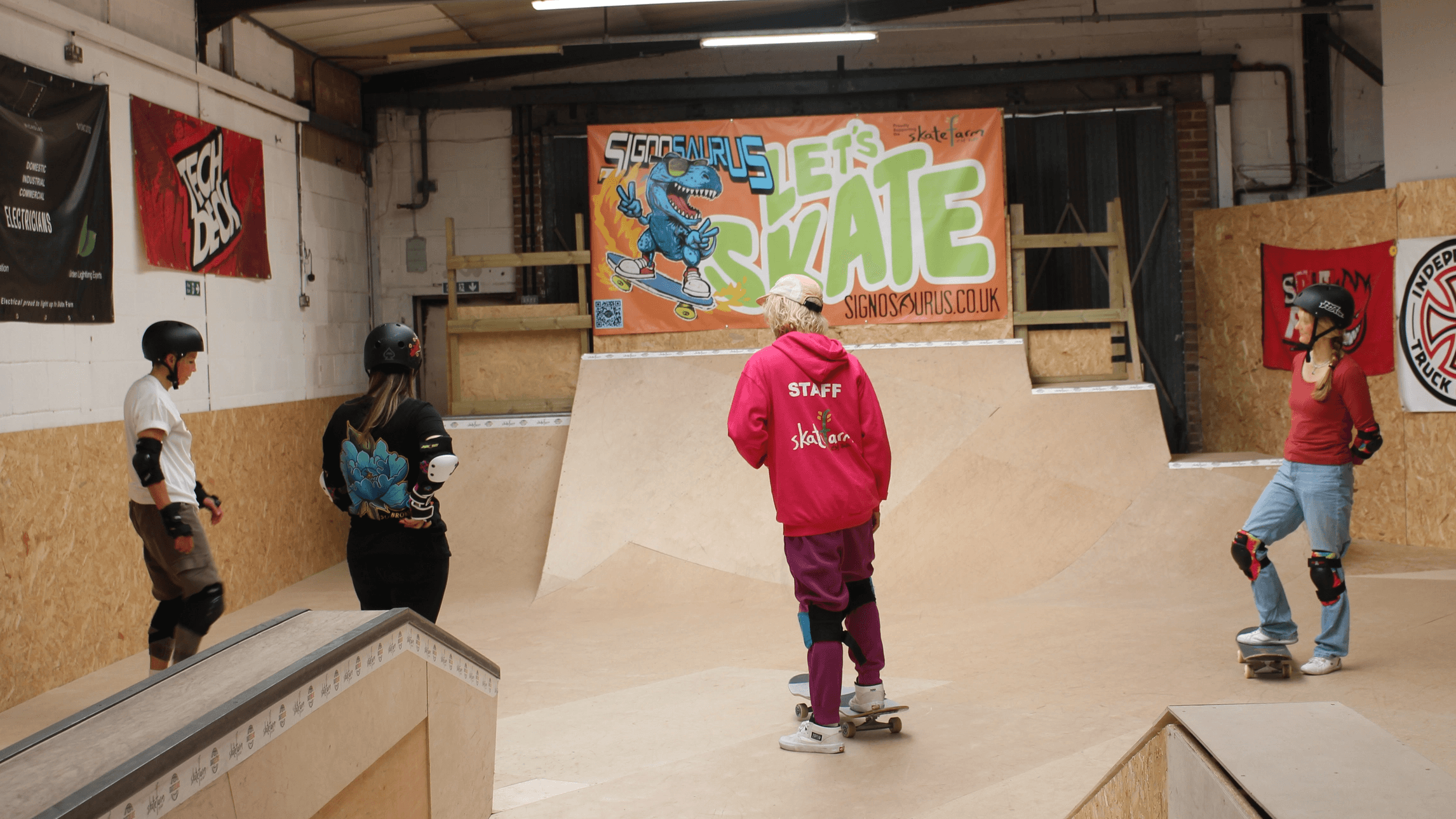 Girls skating at The Skate Farm indoor skatepark in Haywards Heath during a Sunday girls-only session