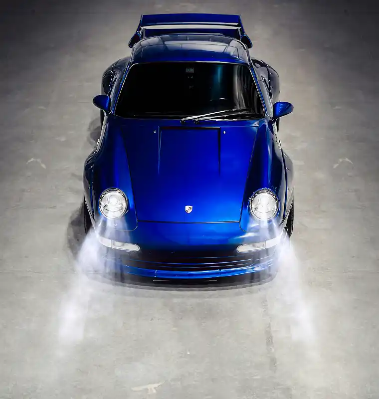 Blue car seen from the front, representing vehicle purchase