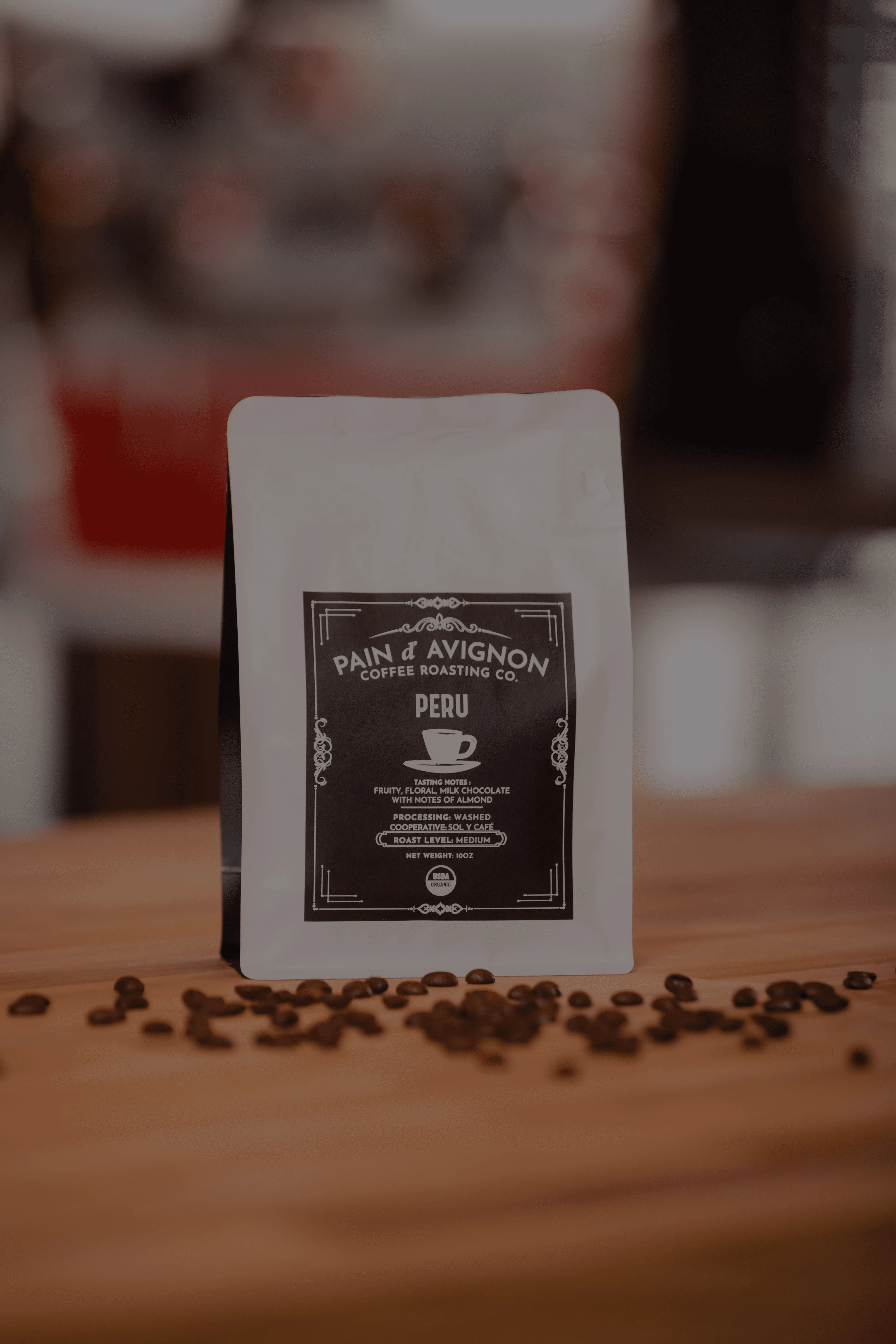 ain d'Avignon Coffee Roasting Co. Peru single-origin — white bag with branded label, espresso roast with chocolate and caramel notes