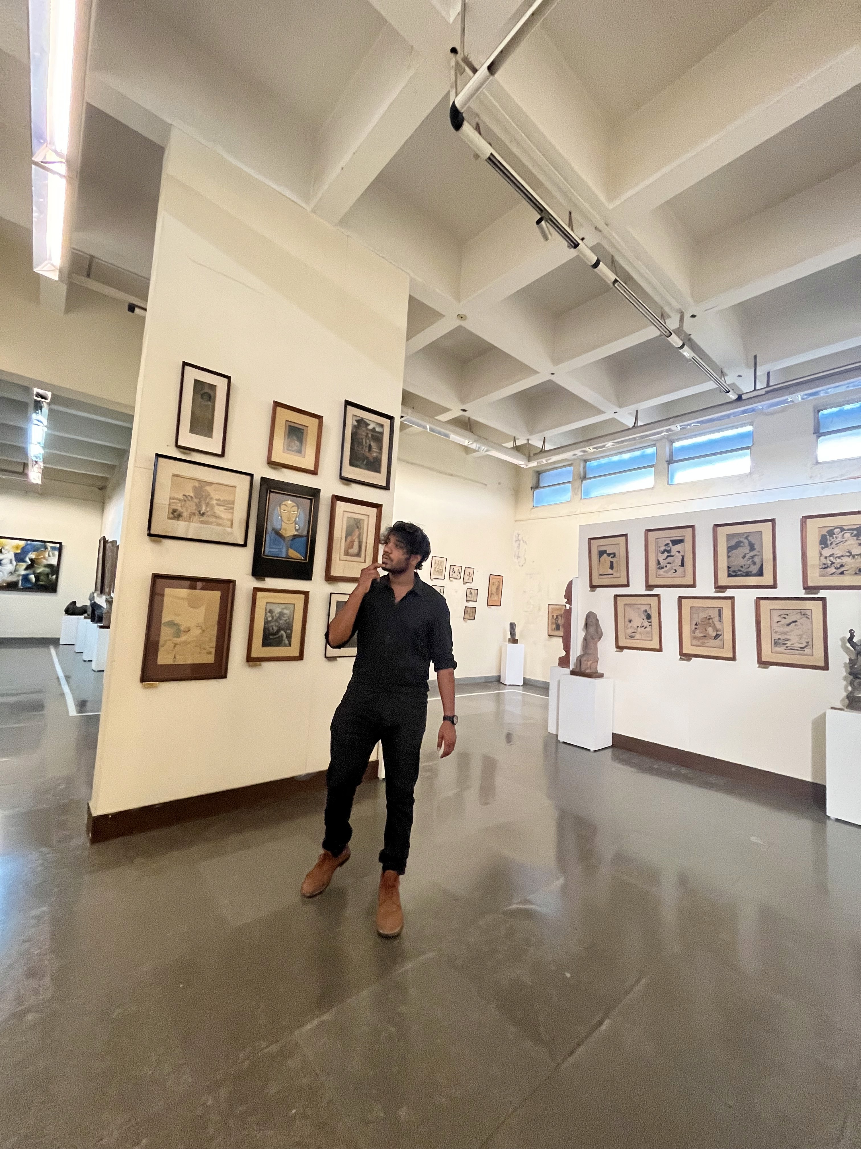 Creative portrait with geometric pink eyewear and bold fashion styling in urban setting