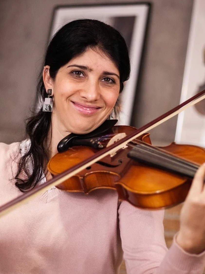 baby playing multicolored xylophone toy