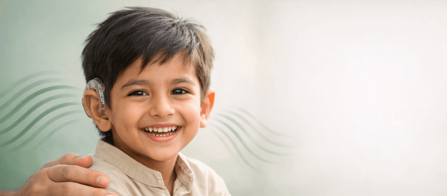 five children smiling while doing peace hand sign